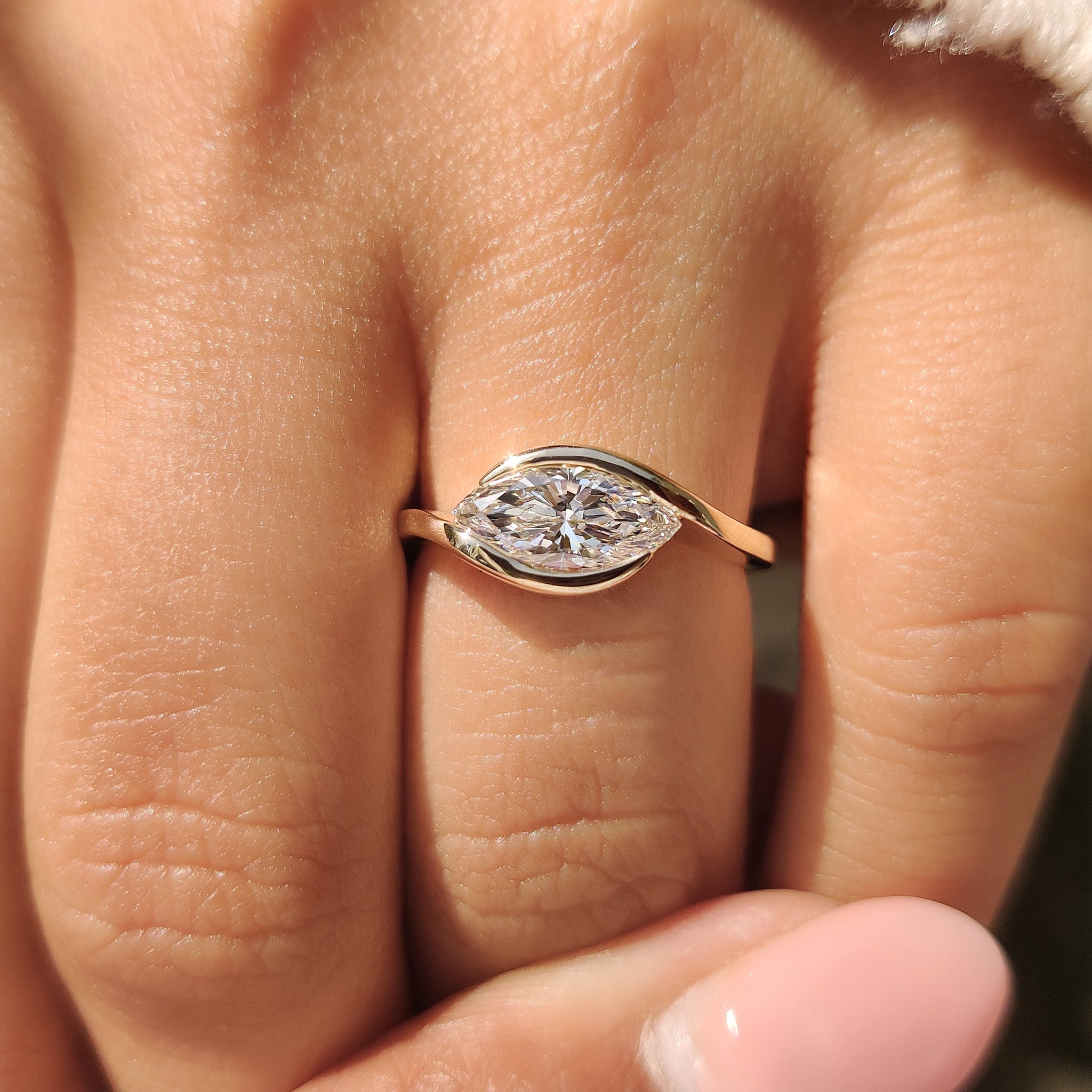 Bypass ring setting with marquise center diamond
