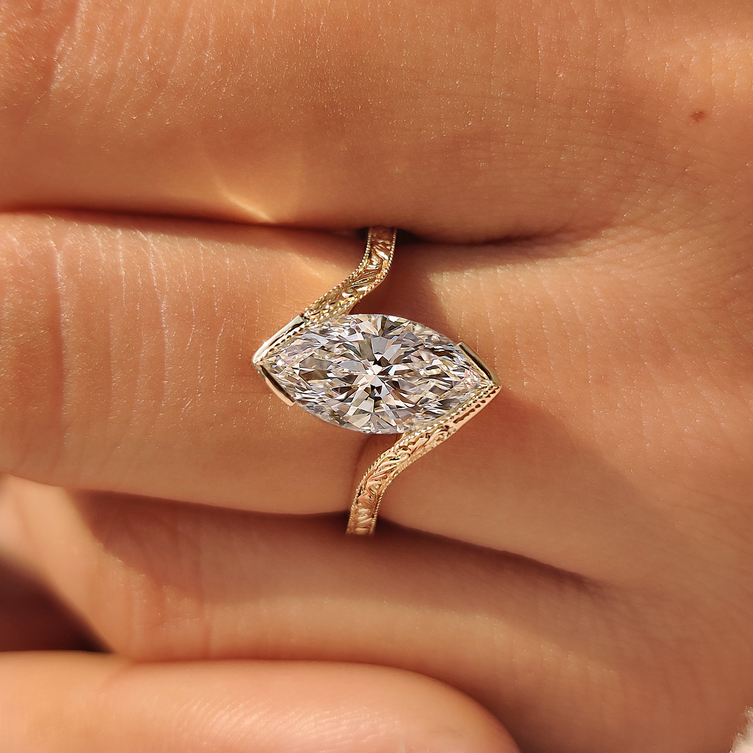 Vintage inspired marquise ring with engraved filigree details.

