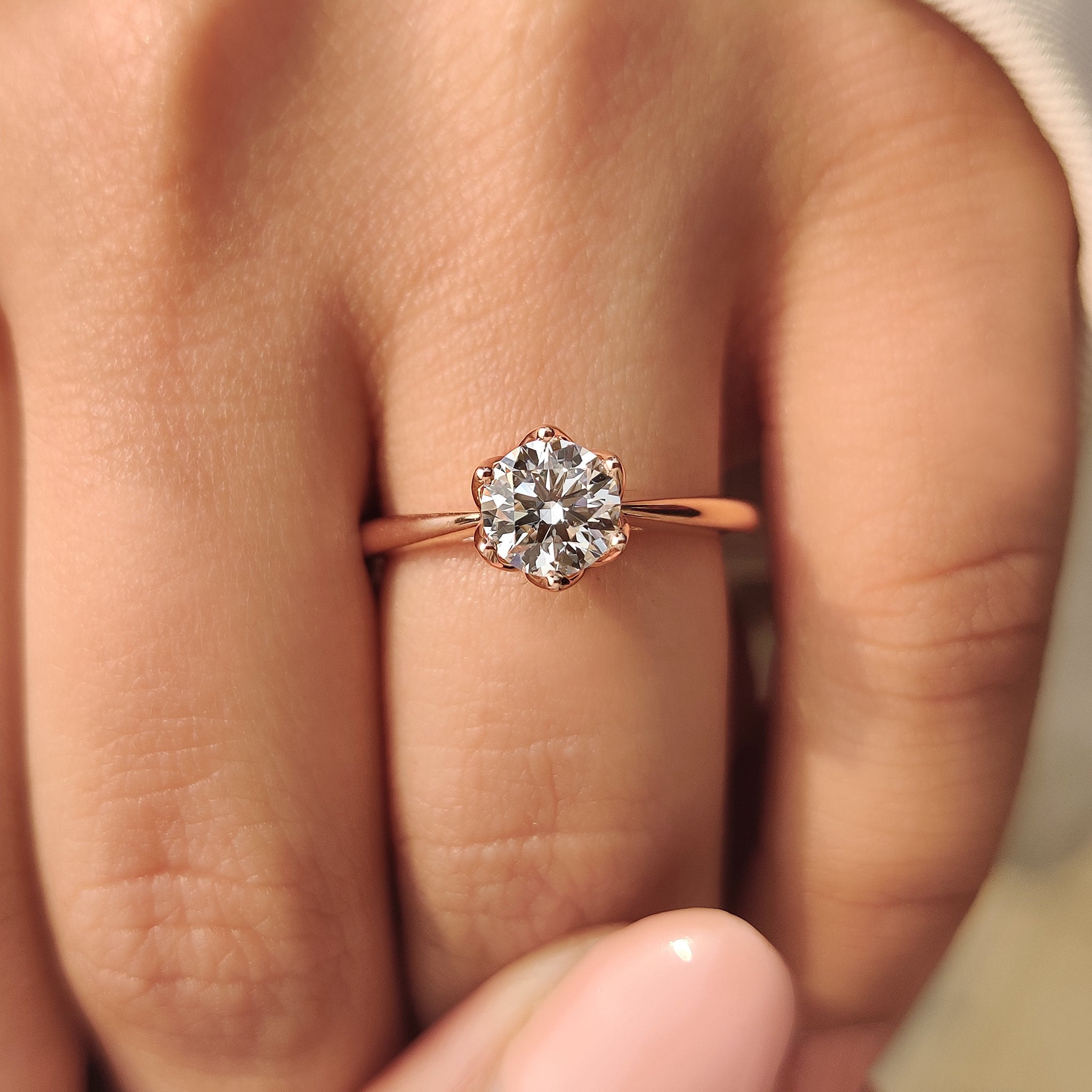 Diamond ring with tapered shank and sapphire.
