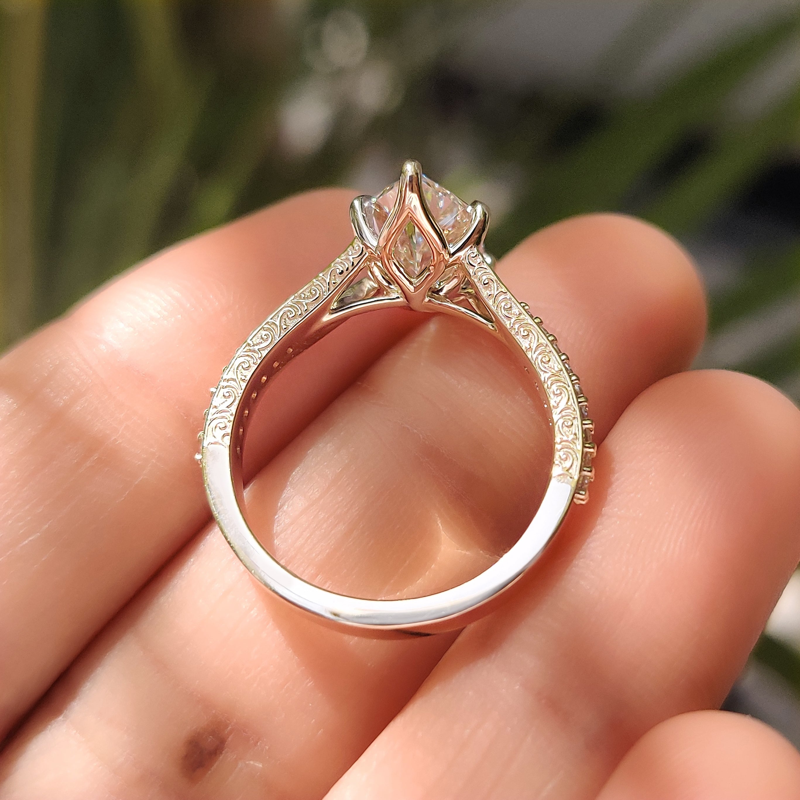 Dutch marquise ring with cathedral setting and six claw prongs
