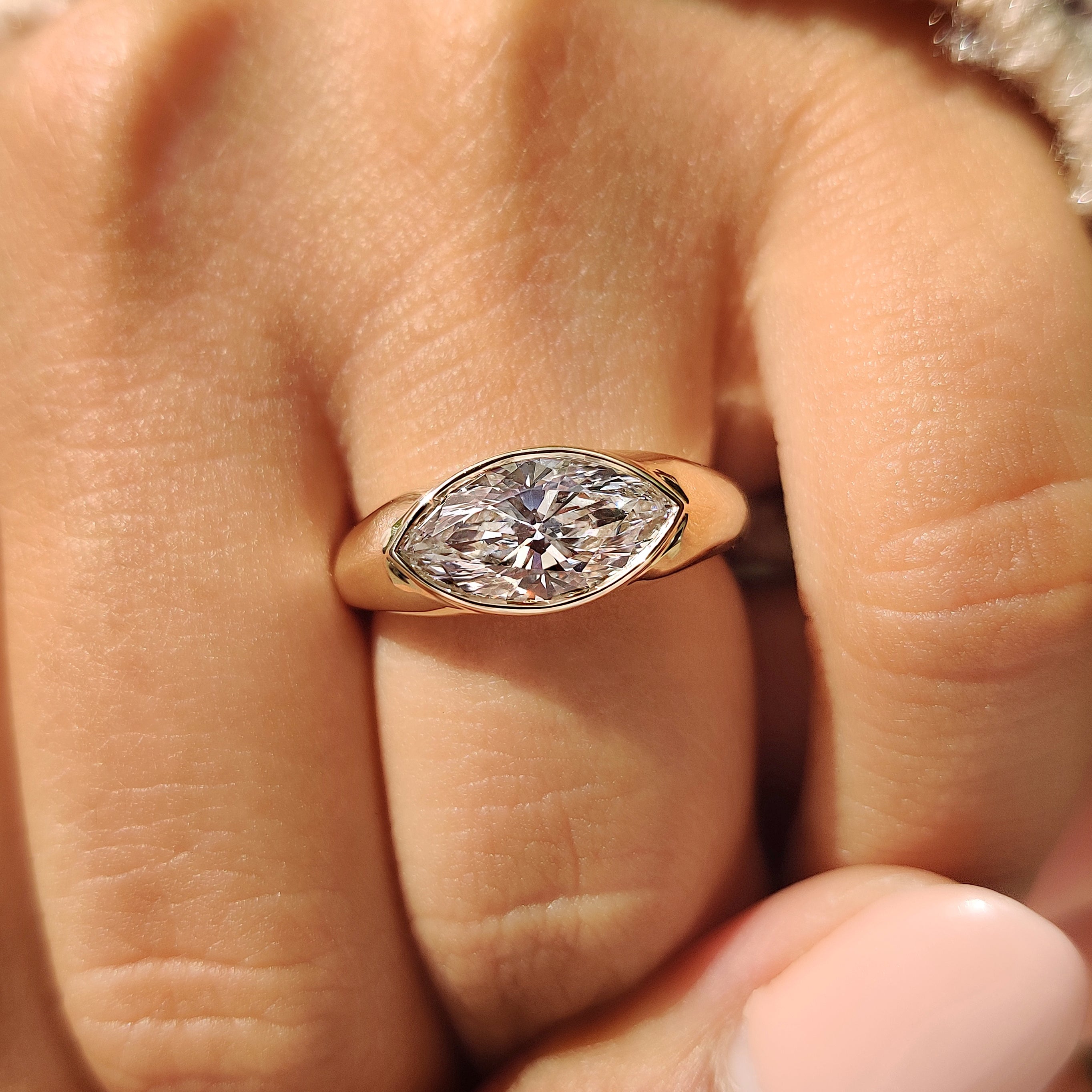 Full bezel marquise diamond engagement ring

