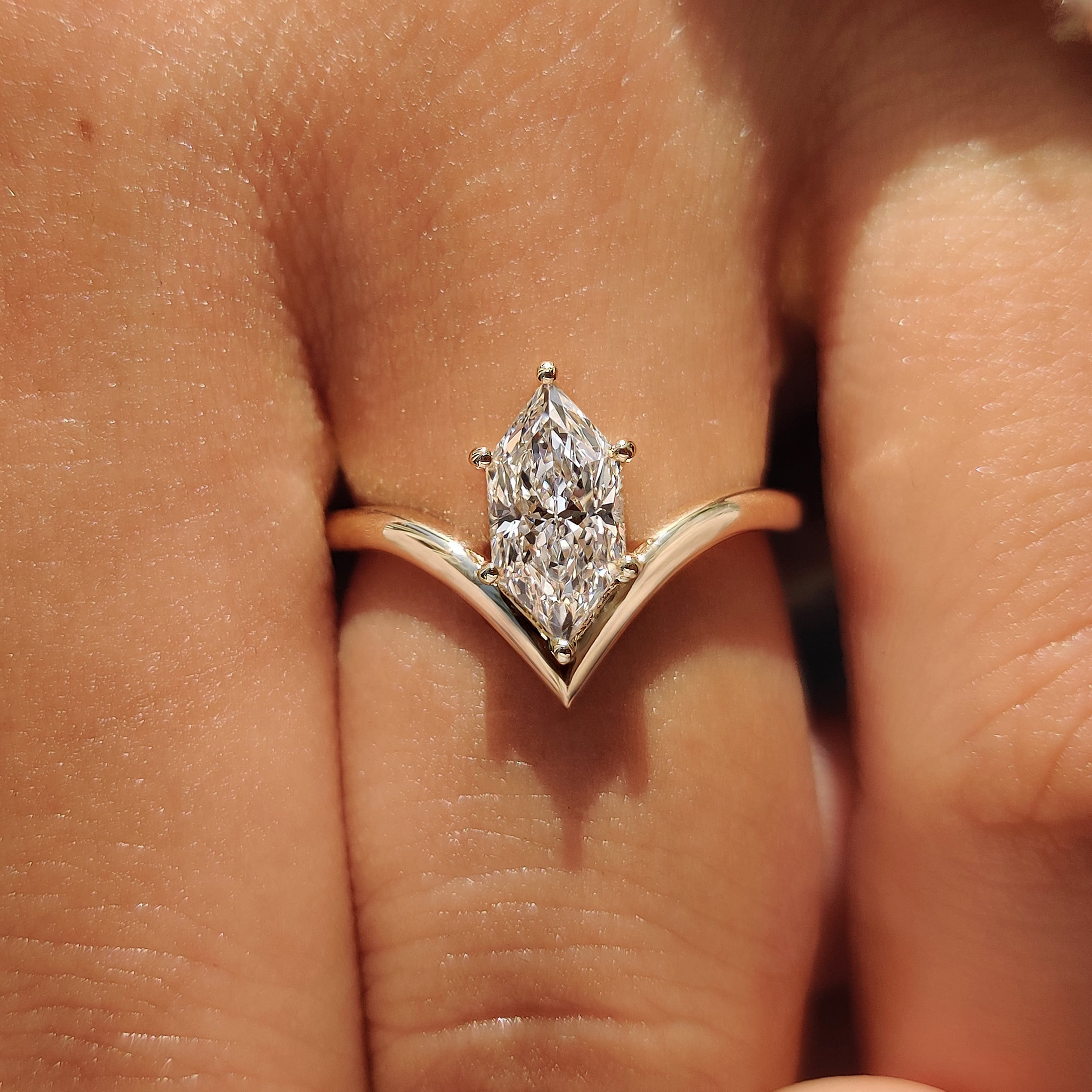 Solitaire engagement ring with Dutch marquise diamond.
