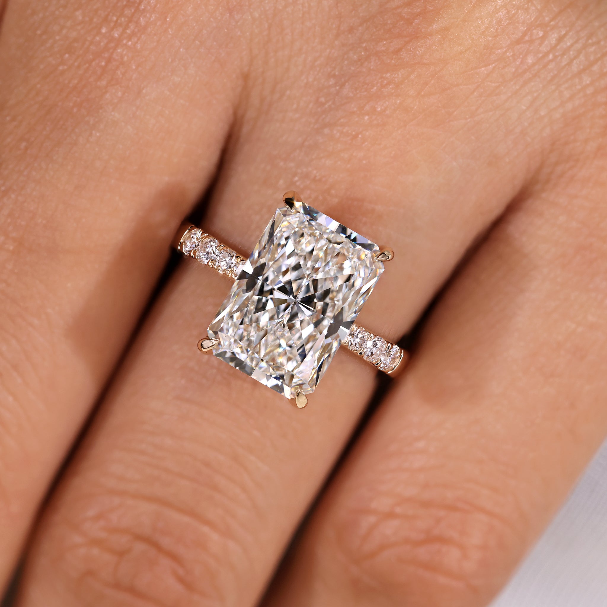 Handmade radiant cut diamond ring with hidden halo
