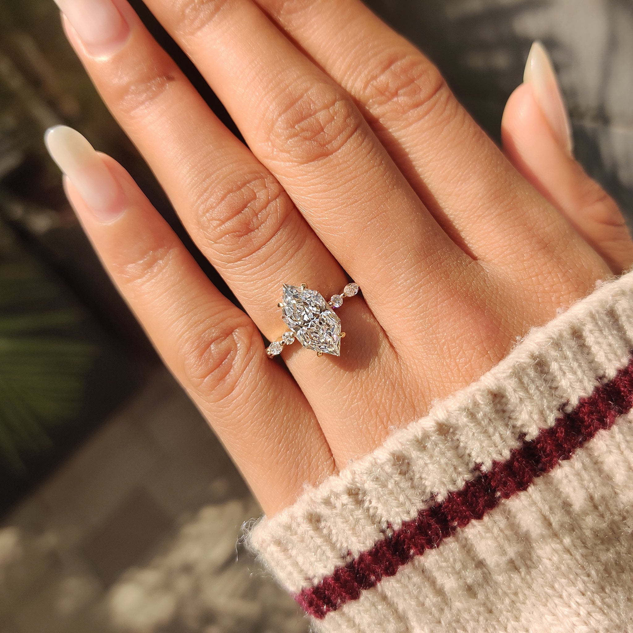 Lab grown dutch marquise engagement ring with pave setting.
