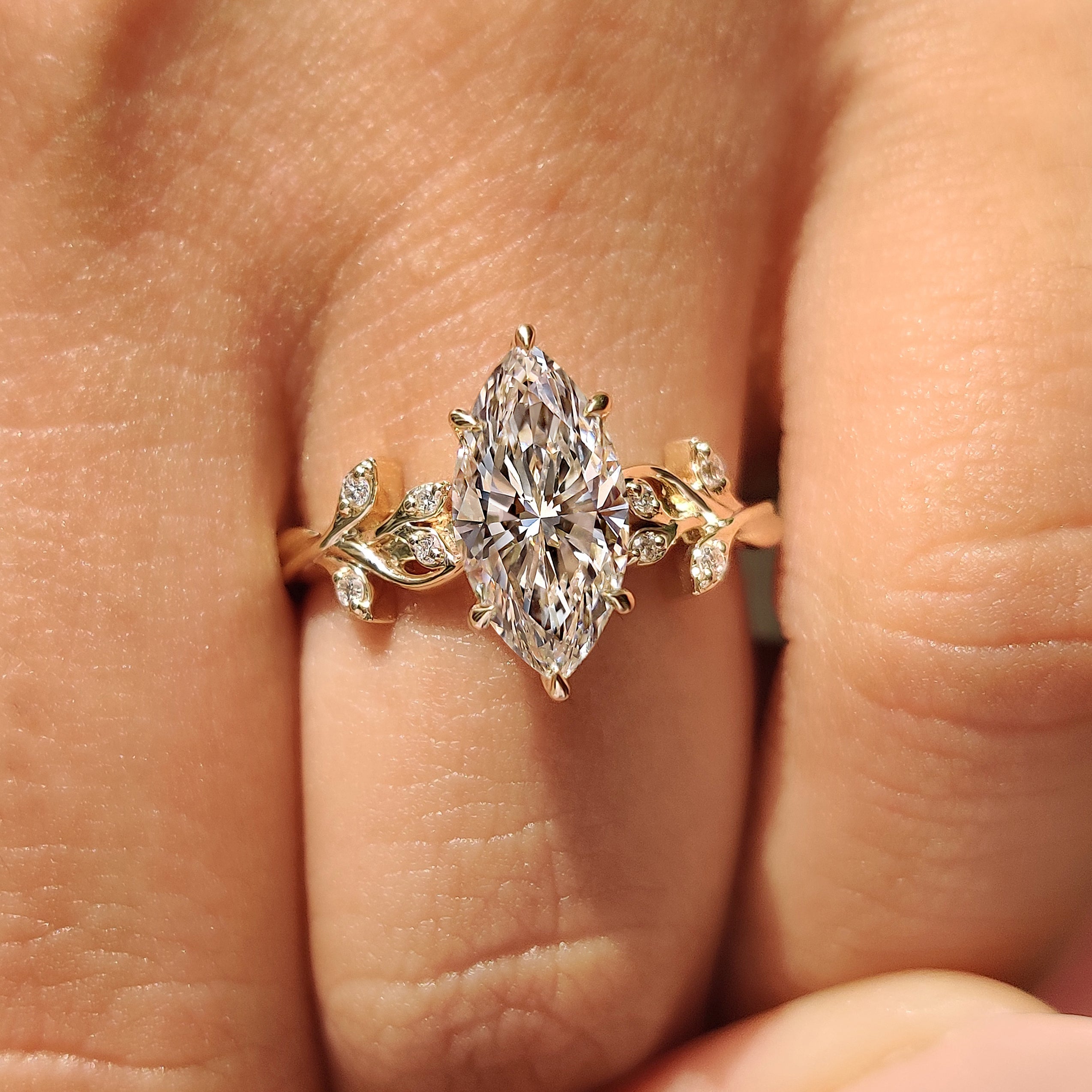 Nature inspired marquise ring with round stones.
