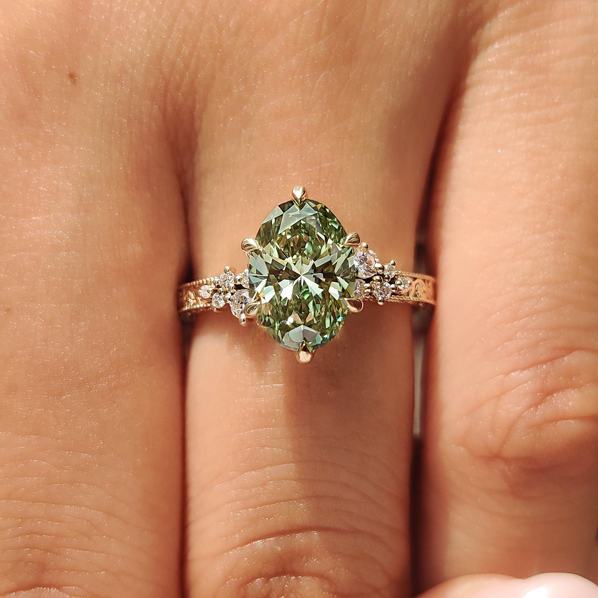 Handmade green oval ring with floral engraved band
