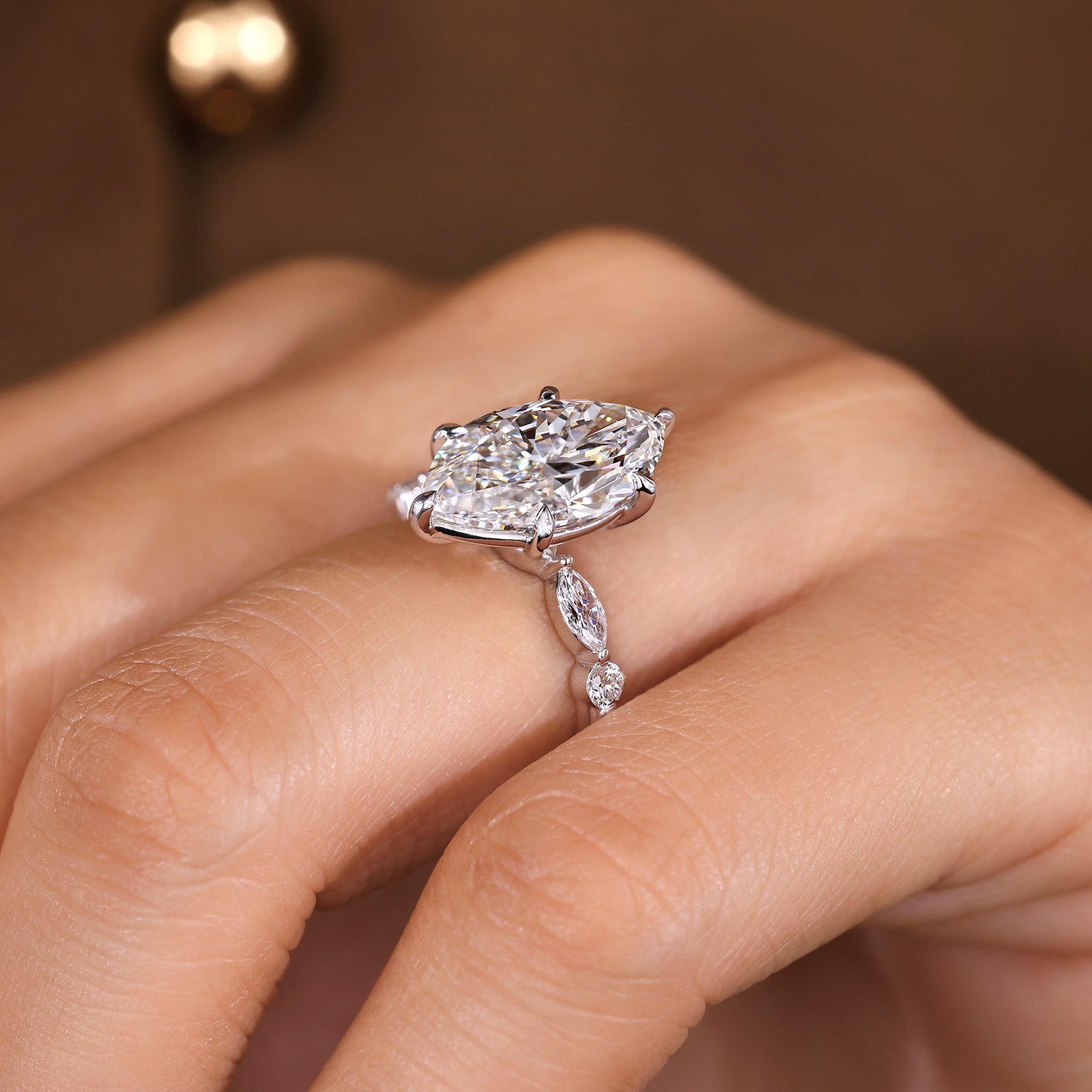 Lab grown marquise diamond ring with six claw prong center
