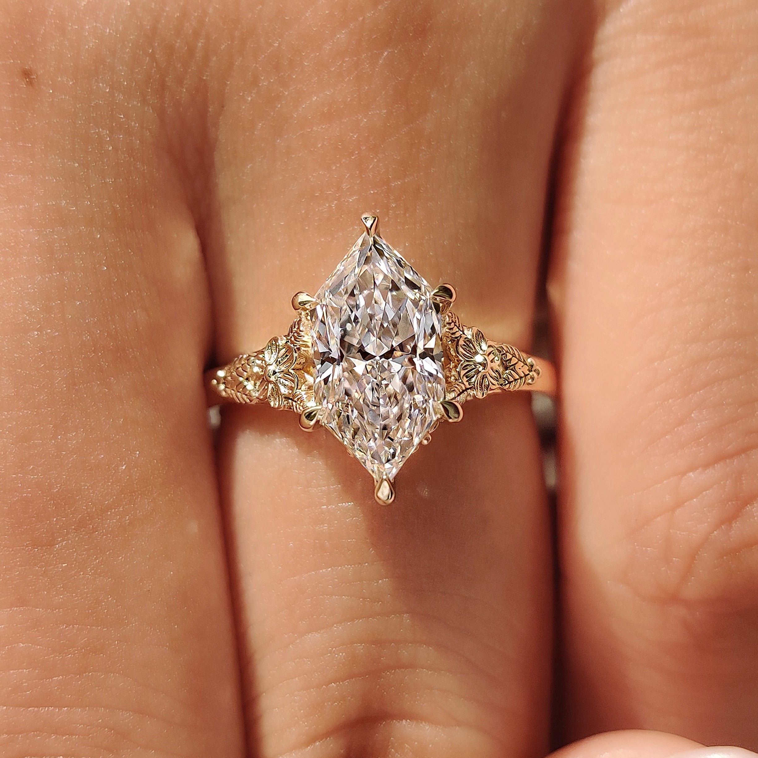 Dutch marquise ring with floral and leaf gallery details
