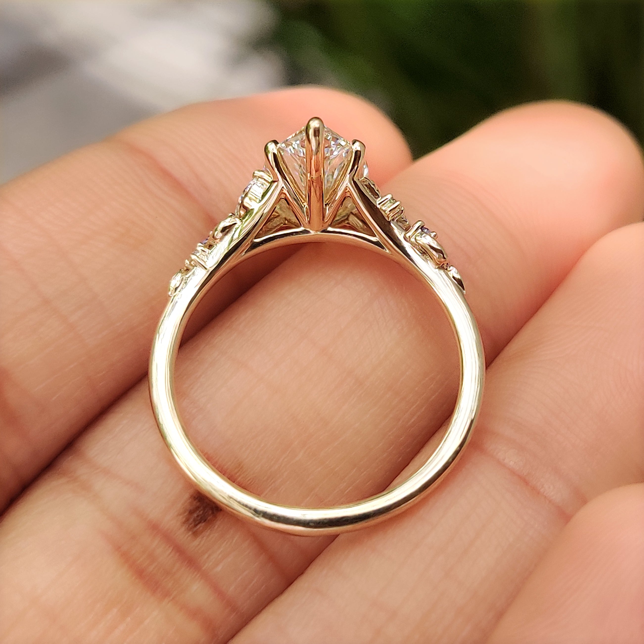 Marquise ring with cluster setting and six prong setting
