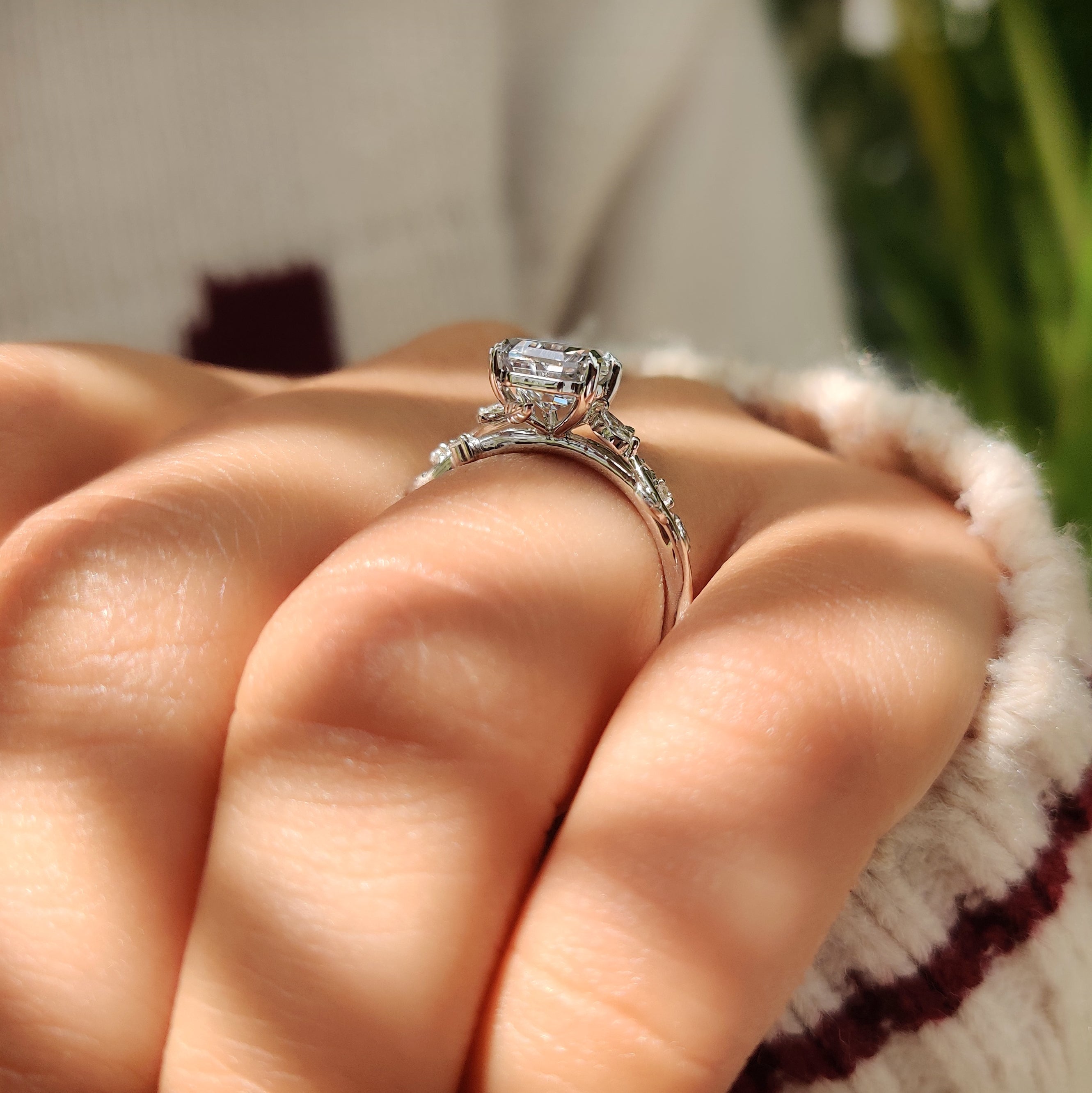 Coffin engagement ring with marquise accents and leaf details.
