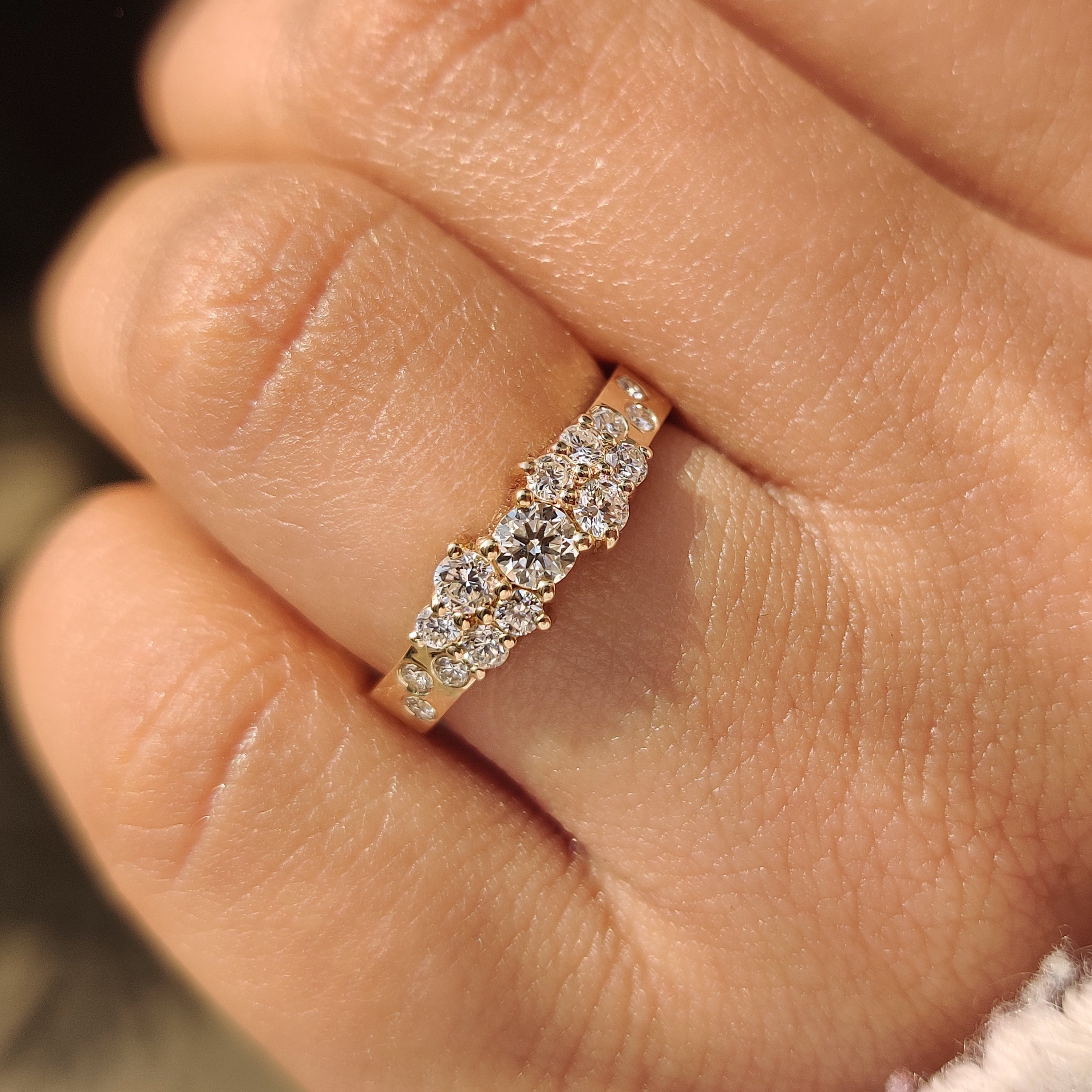 Round diamond band with artistic scattered cluster diamonds.
