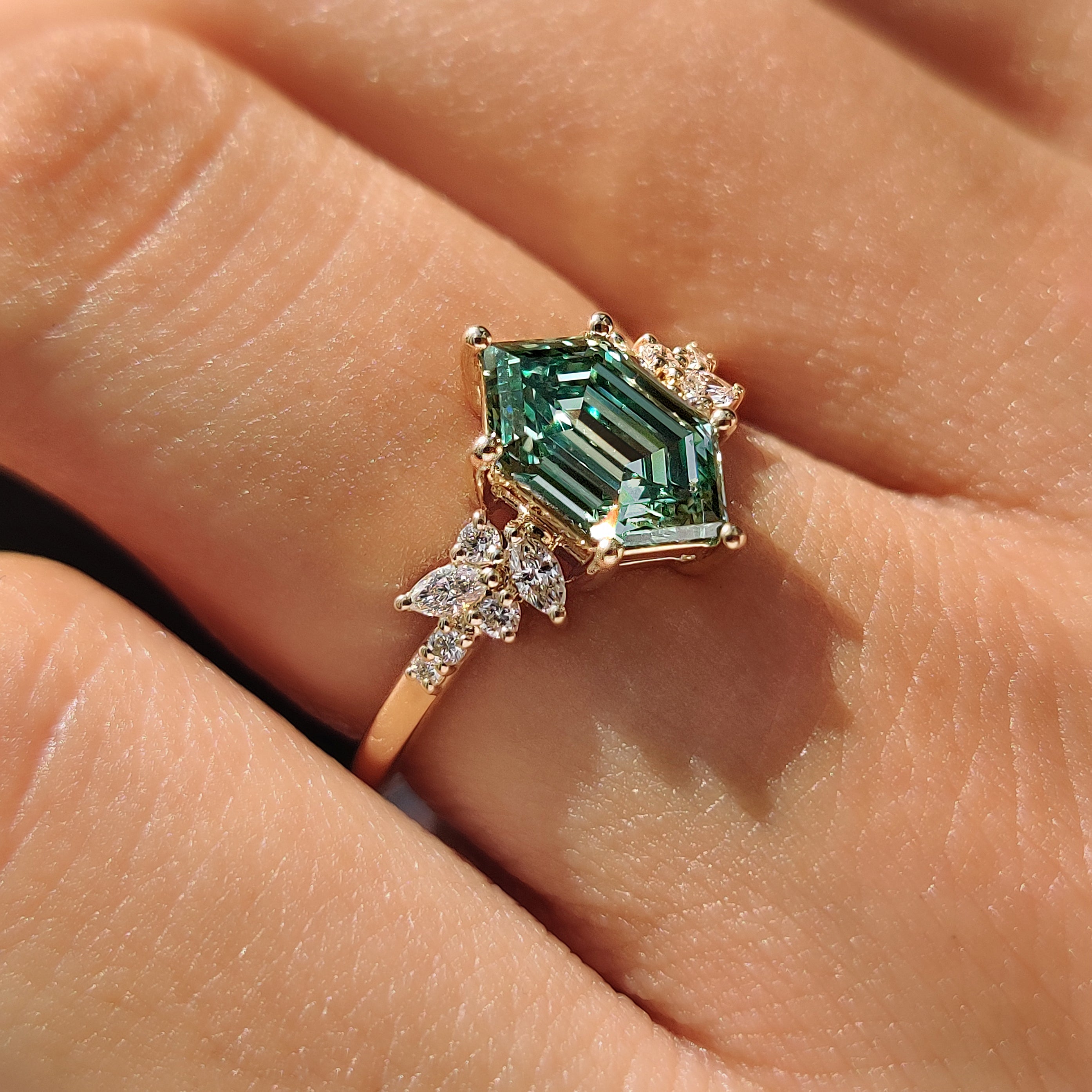 Green hexagon step cut ring in 10K yellow gold.
