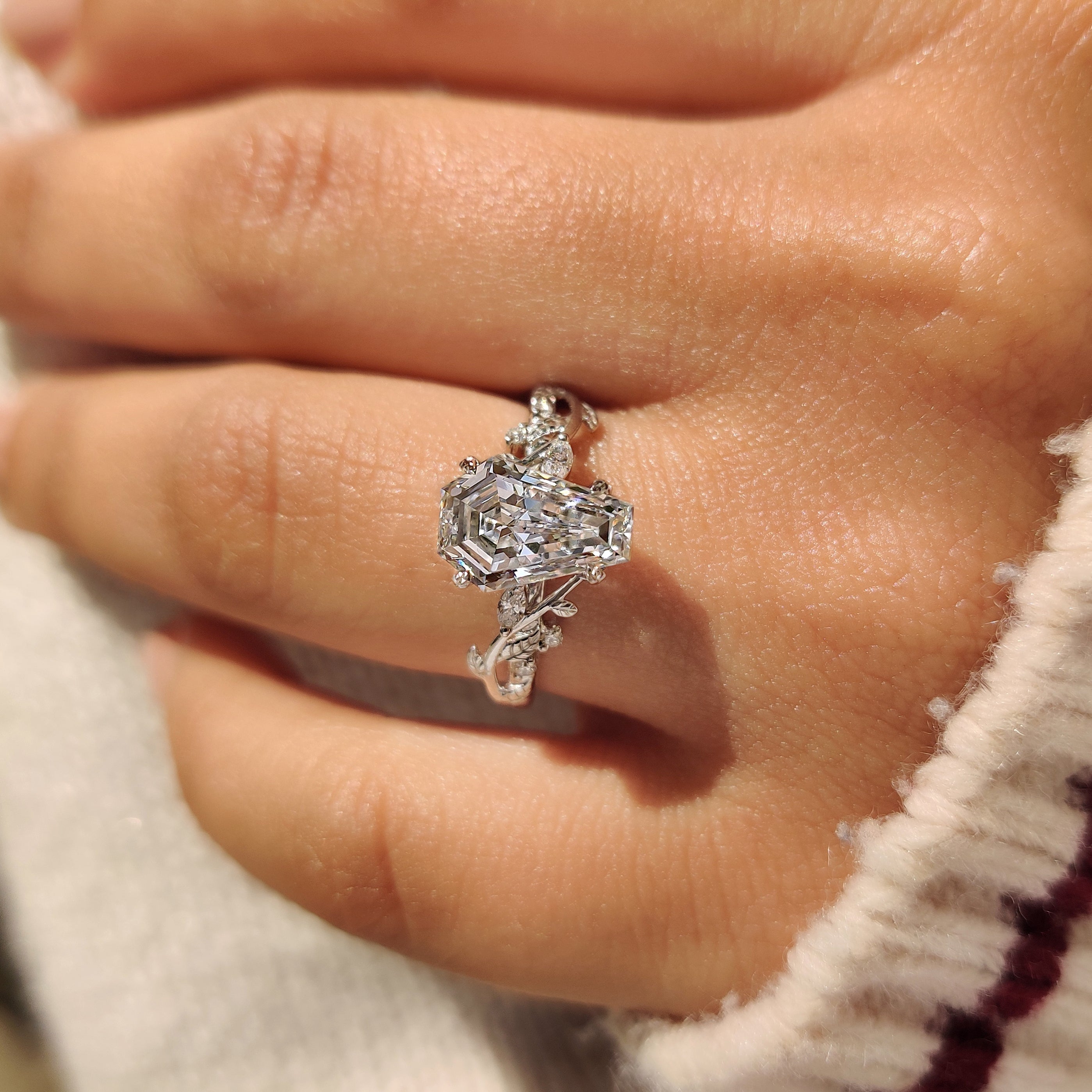Nature inspired coffin diamond ring with leaf detail accents.
