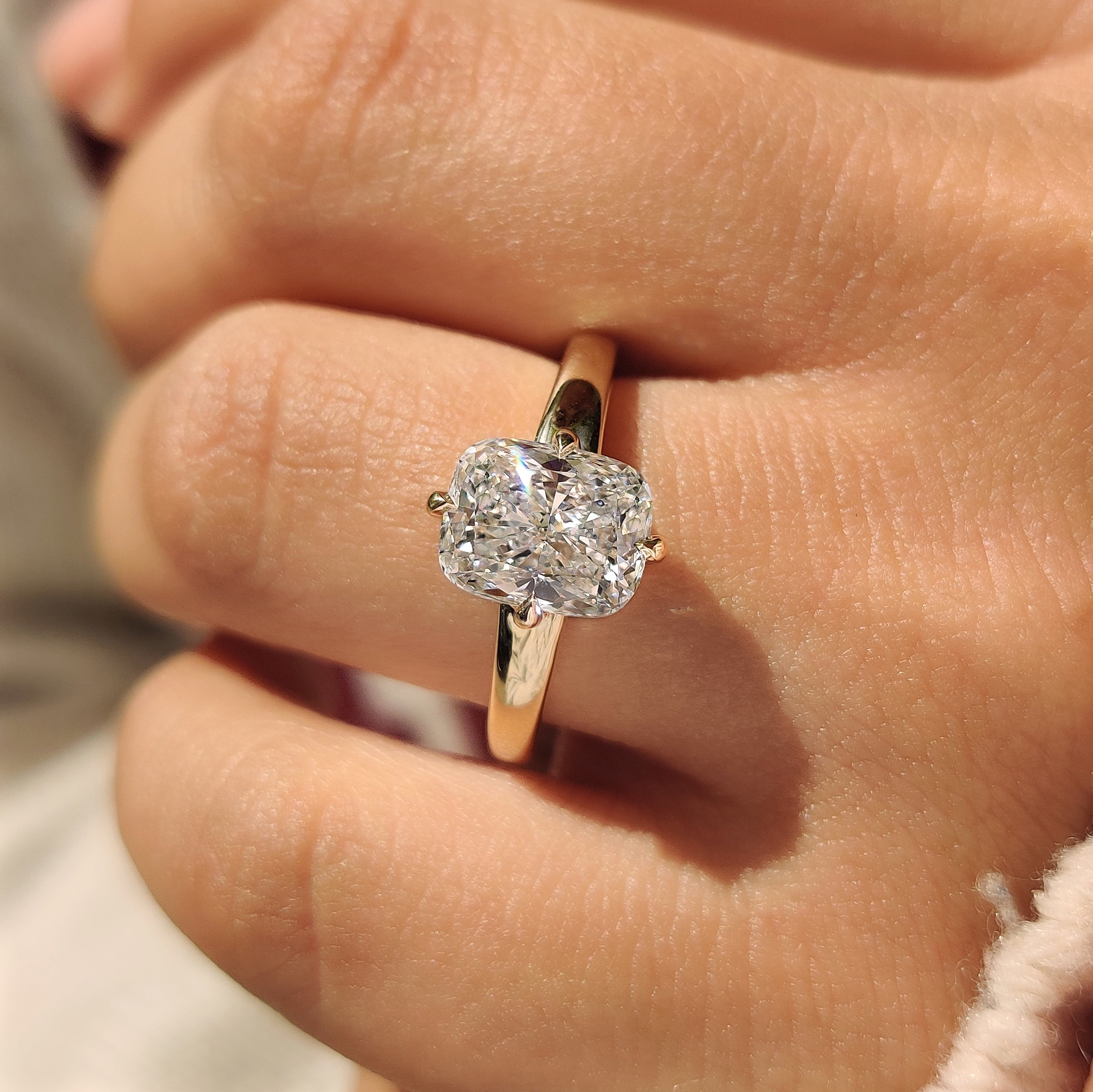 Lab grown cushion diamond ring with compass claw setting
