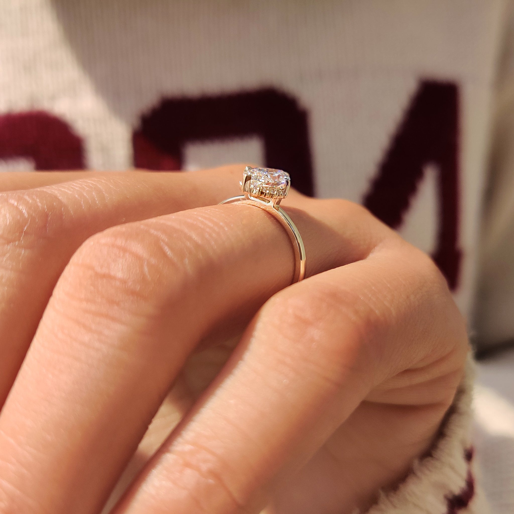 Round cut cluster marquise diamond engagement ring.
