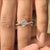 Princess cut diamond ring with four compass prong setting

