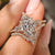 Marquise engagement ring set with curved pave wedding band.
