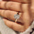 Cushion diamond ring with four compass claw prong setting

