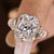 Elongated cushion cut ring with three stone style and trillion side stone
