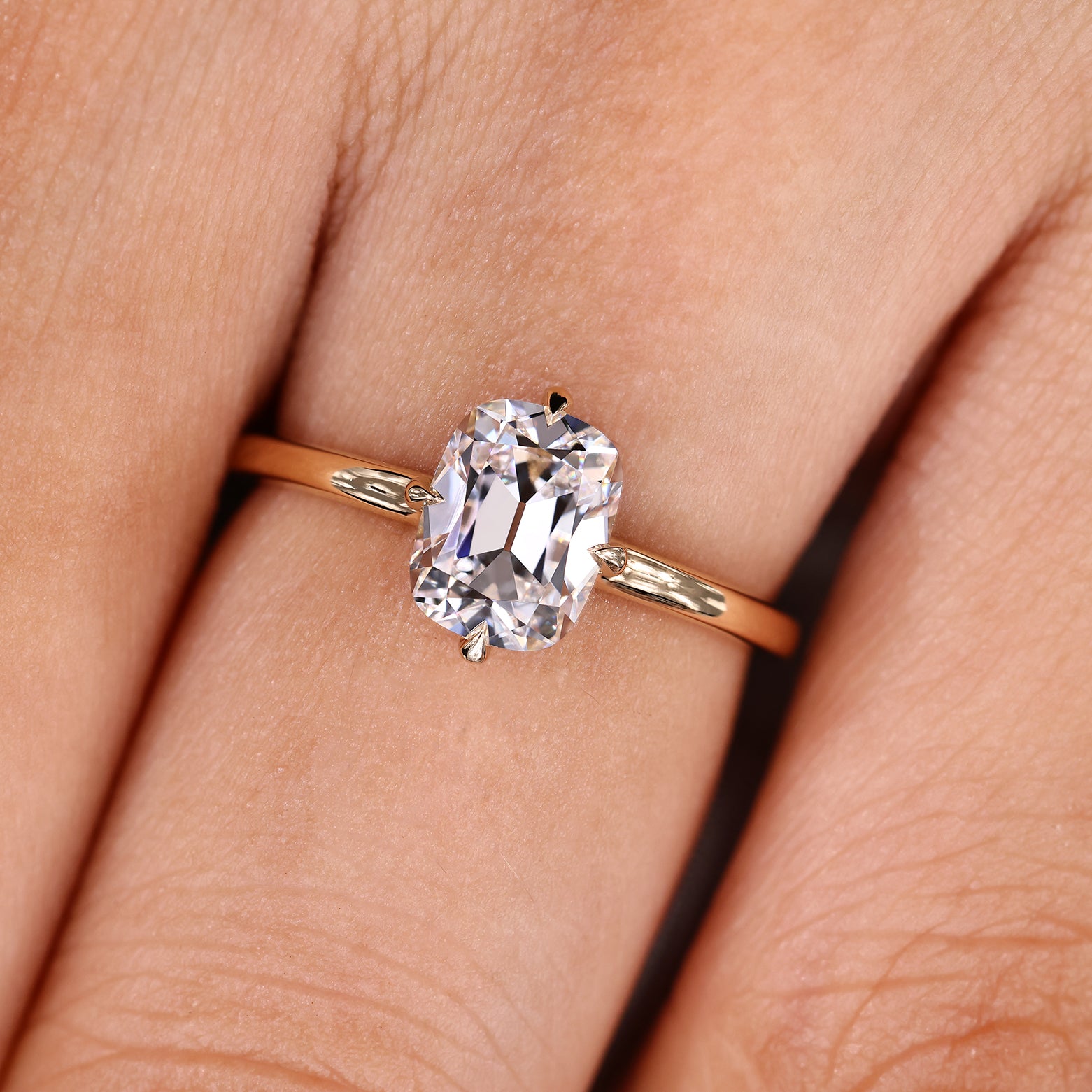 Cushion OMC engagement ring with hidden halo and prongs
