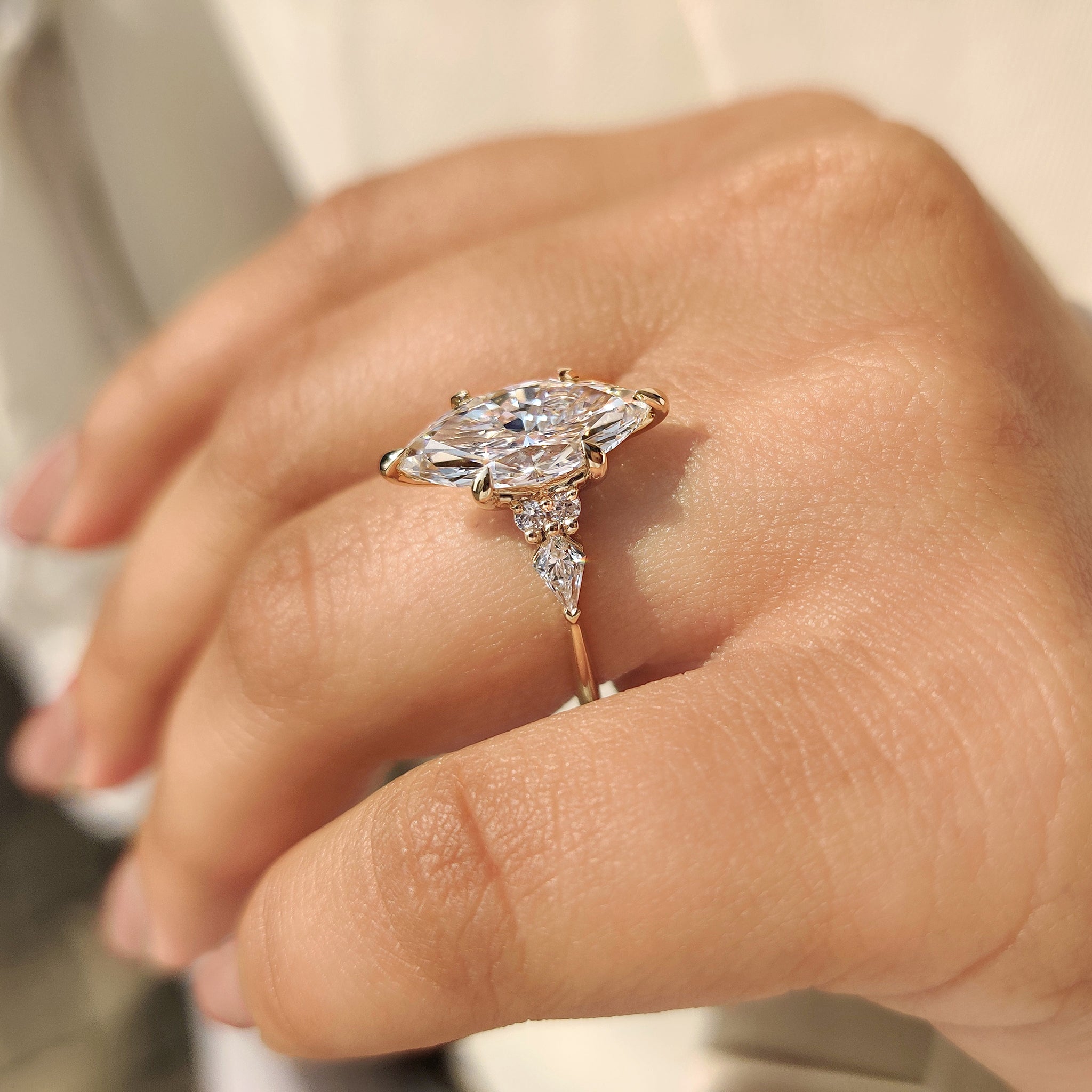 Handmade marquise ring with side stones design.
