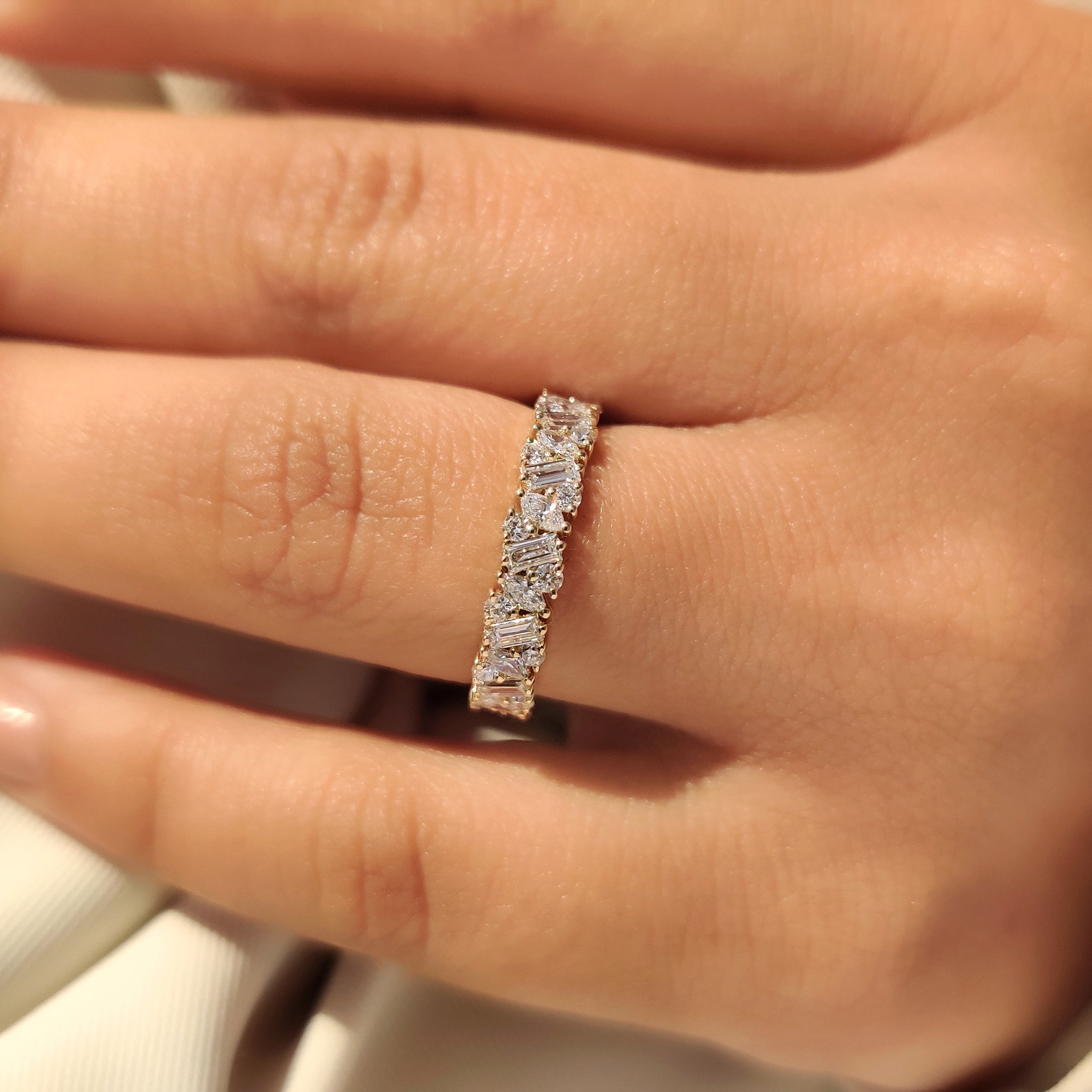 Handmade full eternity ring with prong set diamonds.
