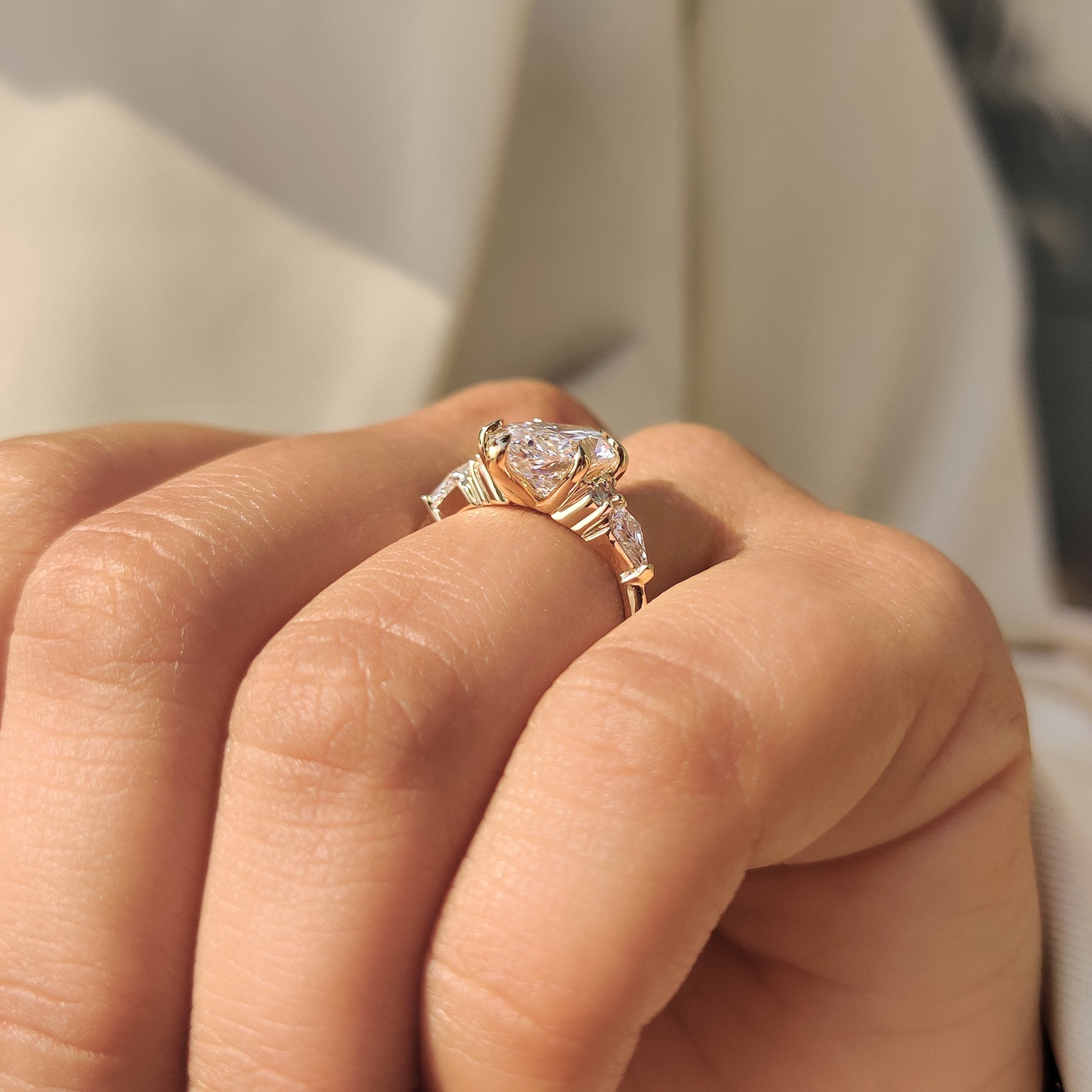 Marquise ring with round and kite side stones.
