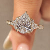 Pear cut diamond ring with pear round side stones.
