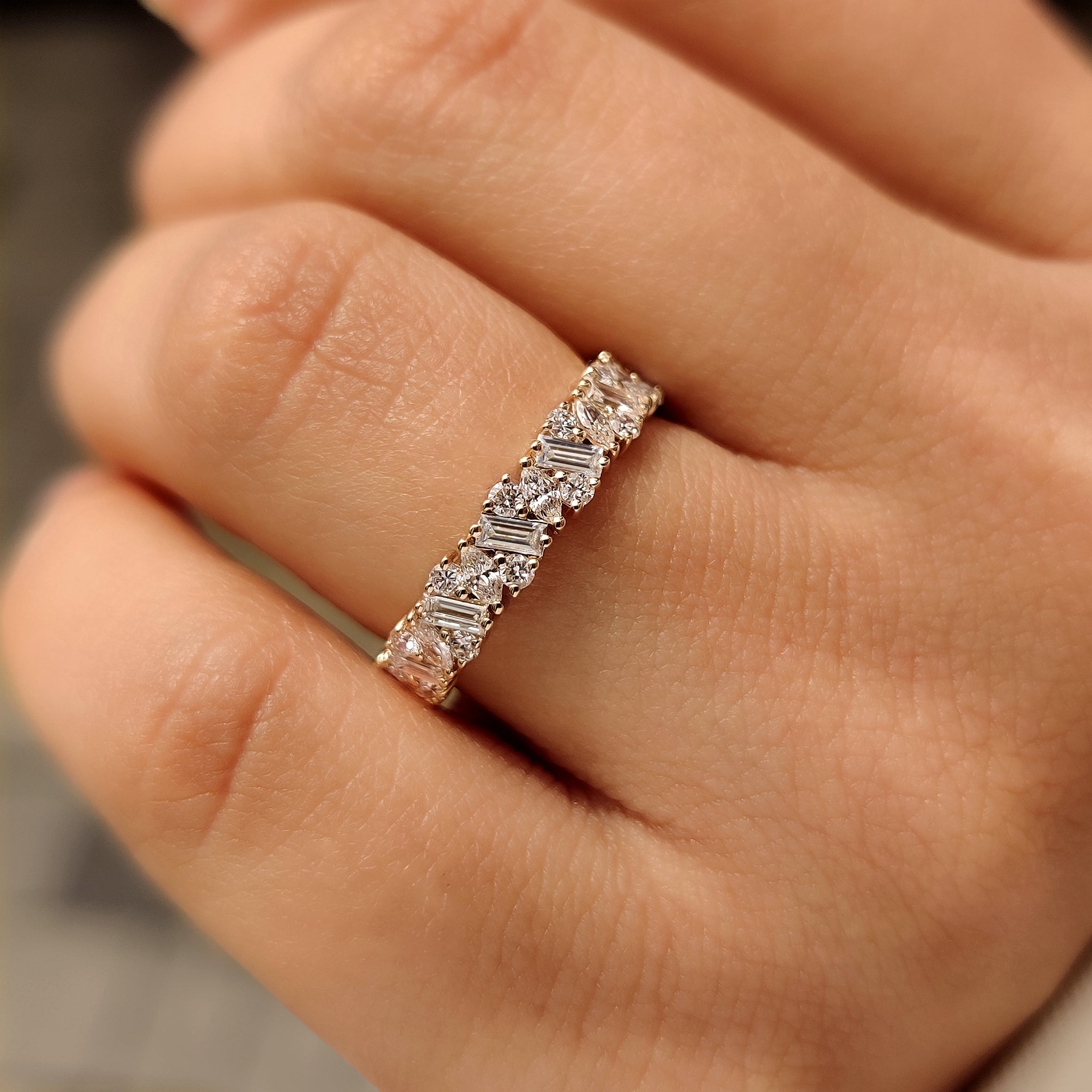 Carat Diamonds eternity band with round and baguette stones.
