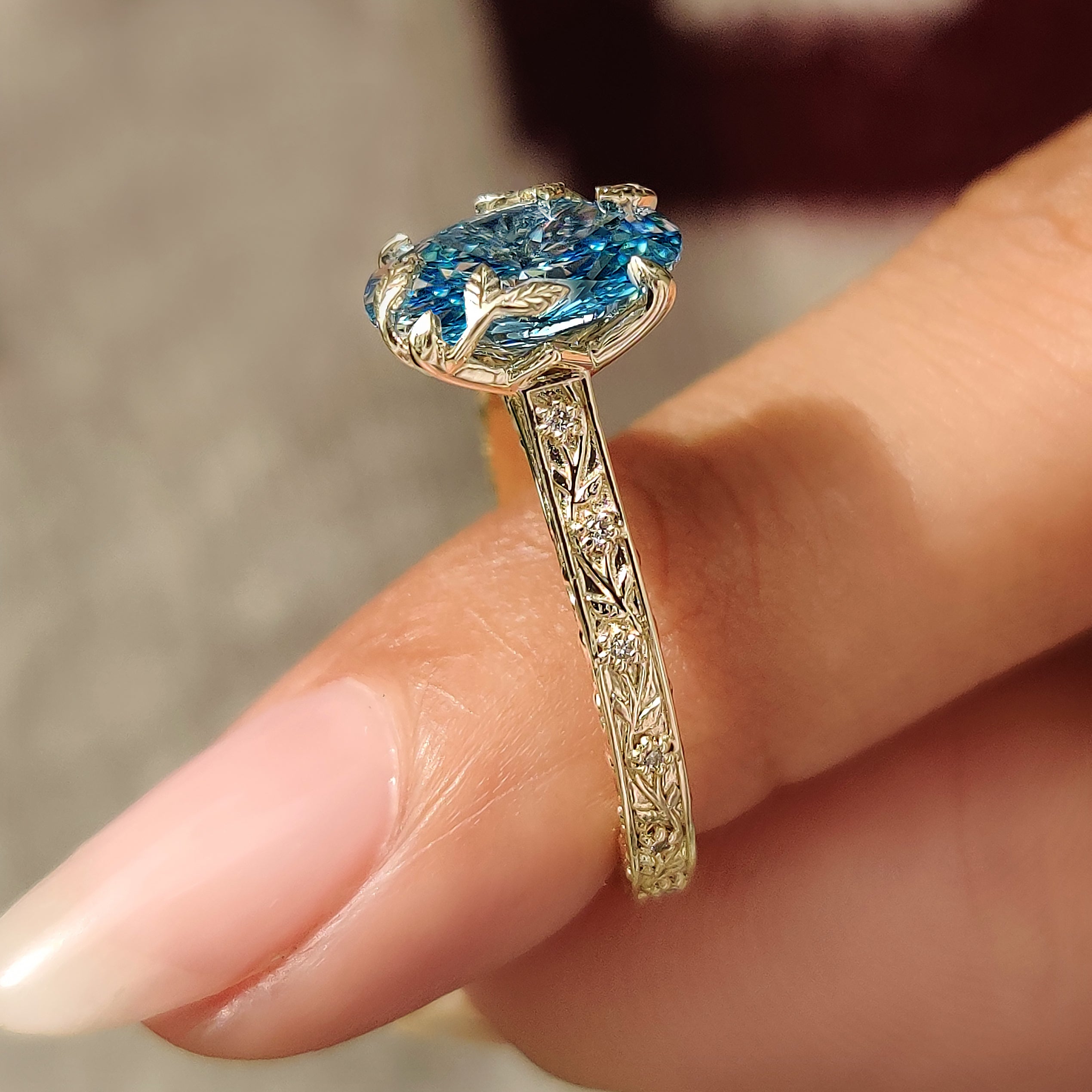 Nature inspired oval ring with engraved floral shank
