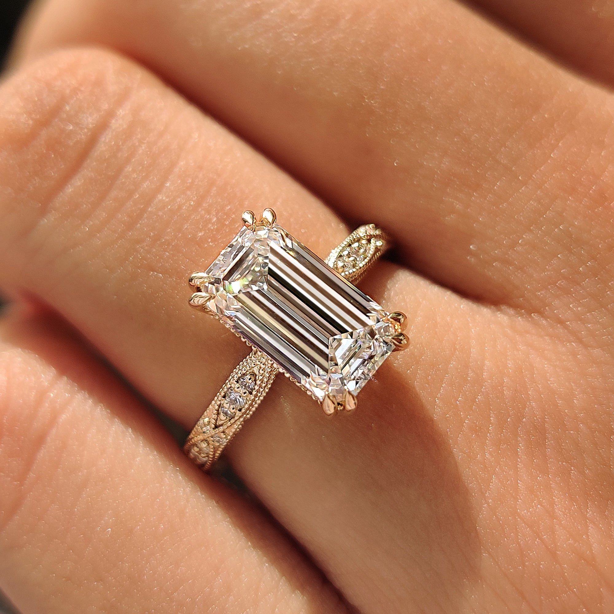 Vintage inspired emerald ring with round cut pave.
