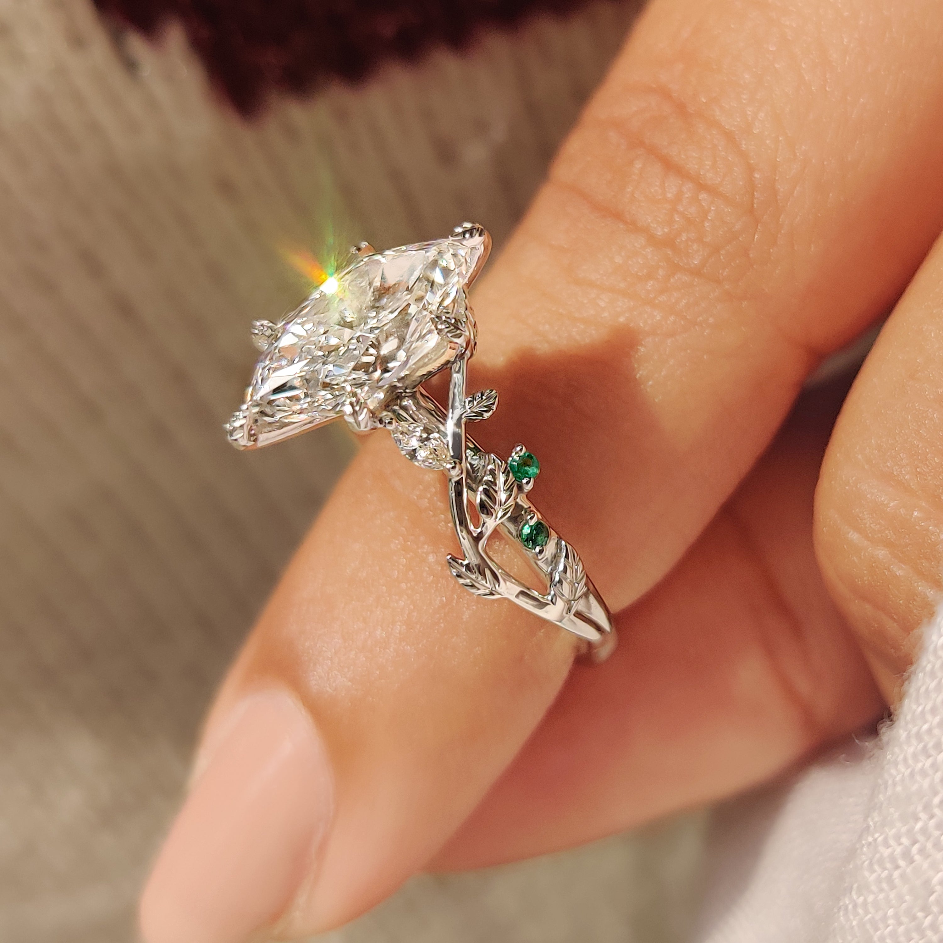 Dutch marquise diamond ring with cluster style stone arrangement
