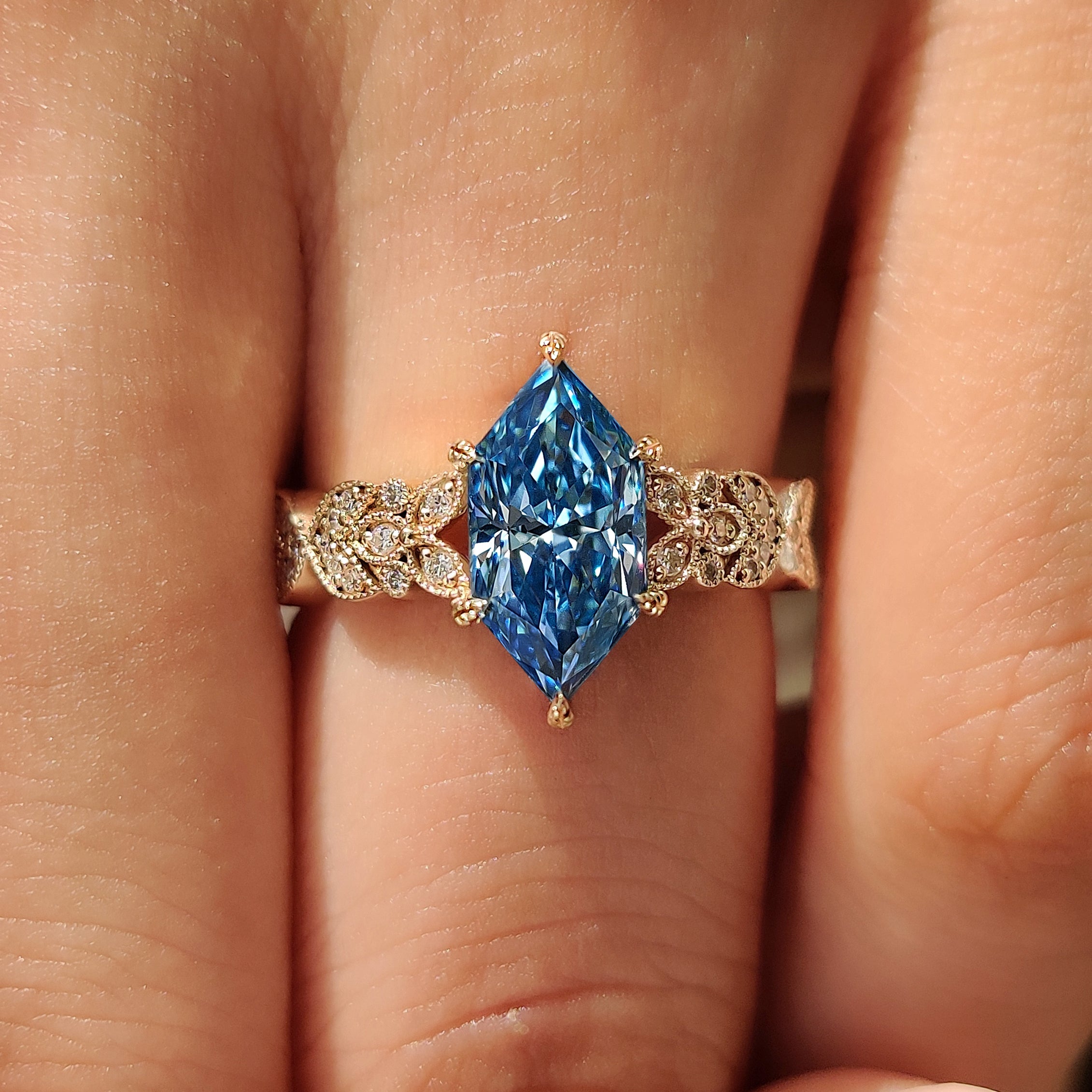 Round diamond accents on Dutch marquise ring
