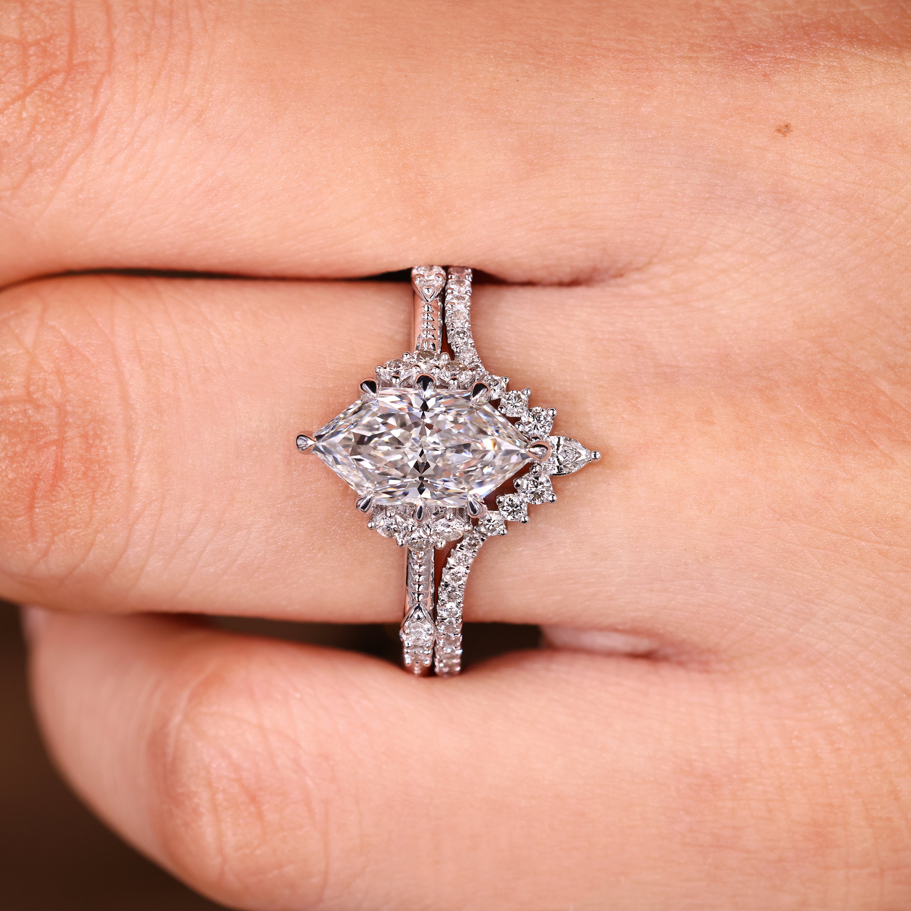 Dutch marquise diamond ring with milgrain and curved band
