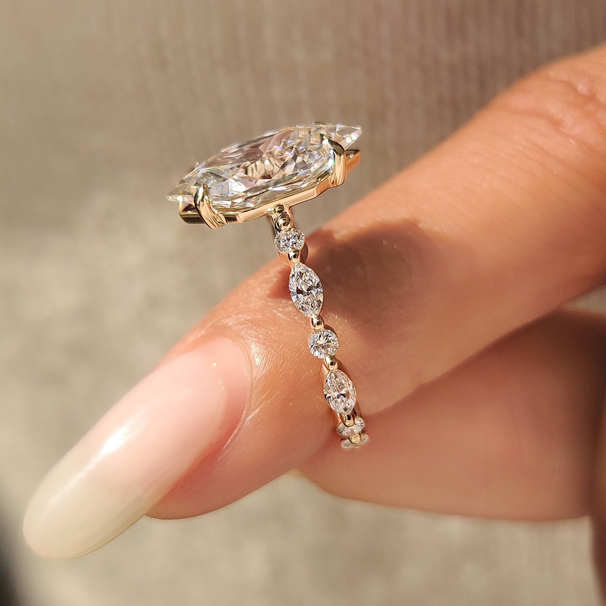 Dutch marquise diamond ring with marquise and round pave.
