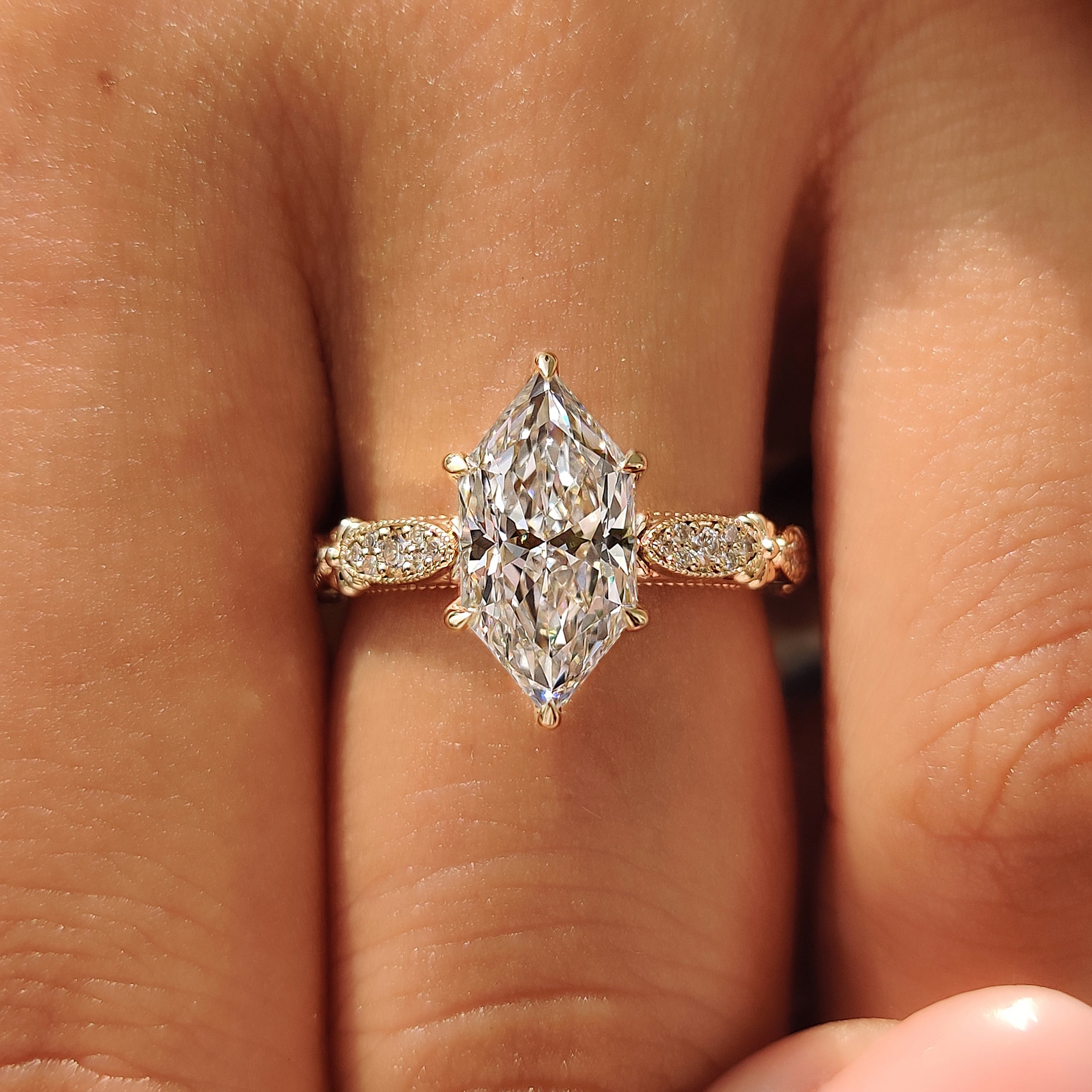 Yellow gold Dutch marquise ring with pave style details.
