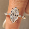 Dutch marquise engagement ring with shared prong pave band.
