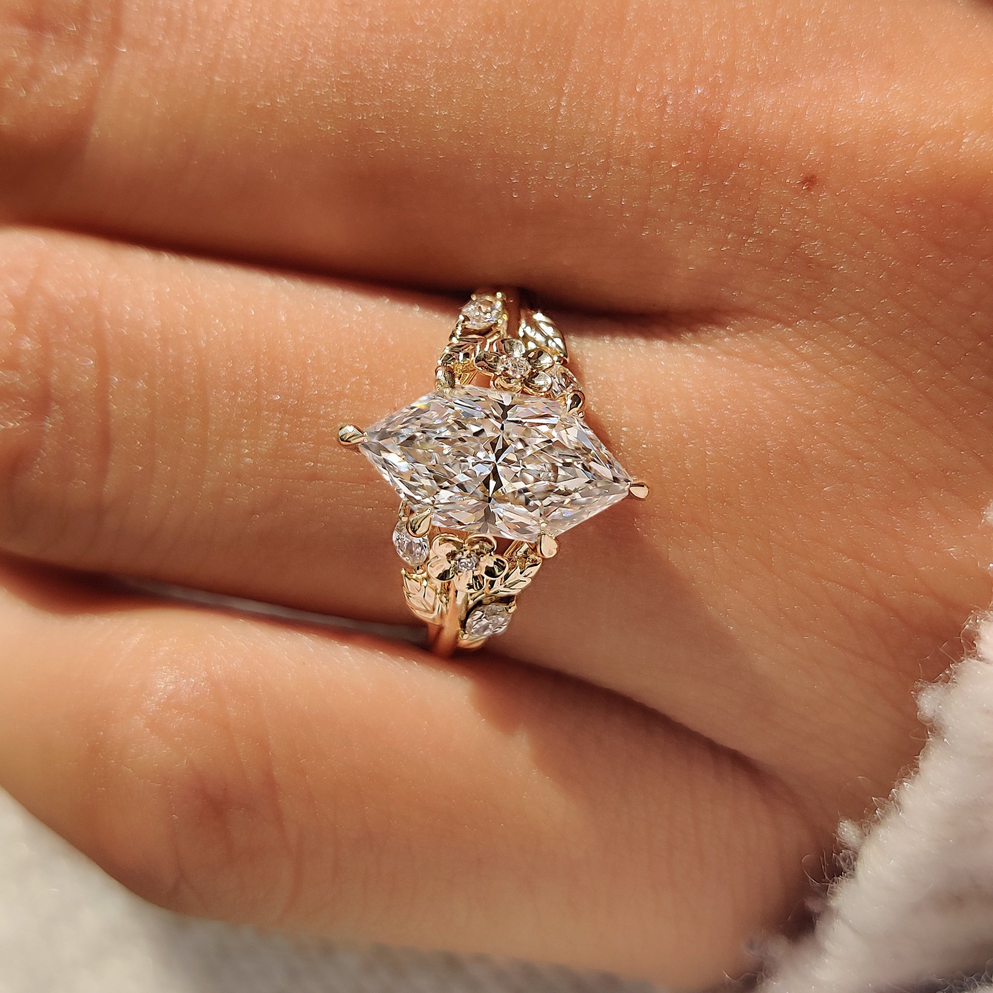 Dutch marquise engagement ring with marquise and round side stones.
