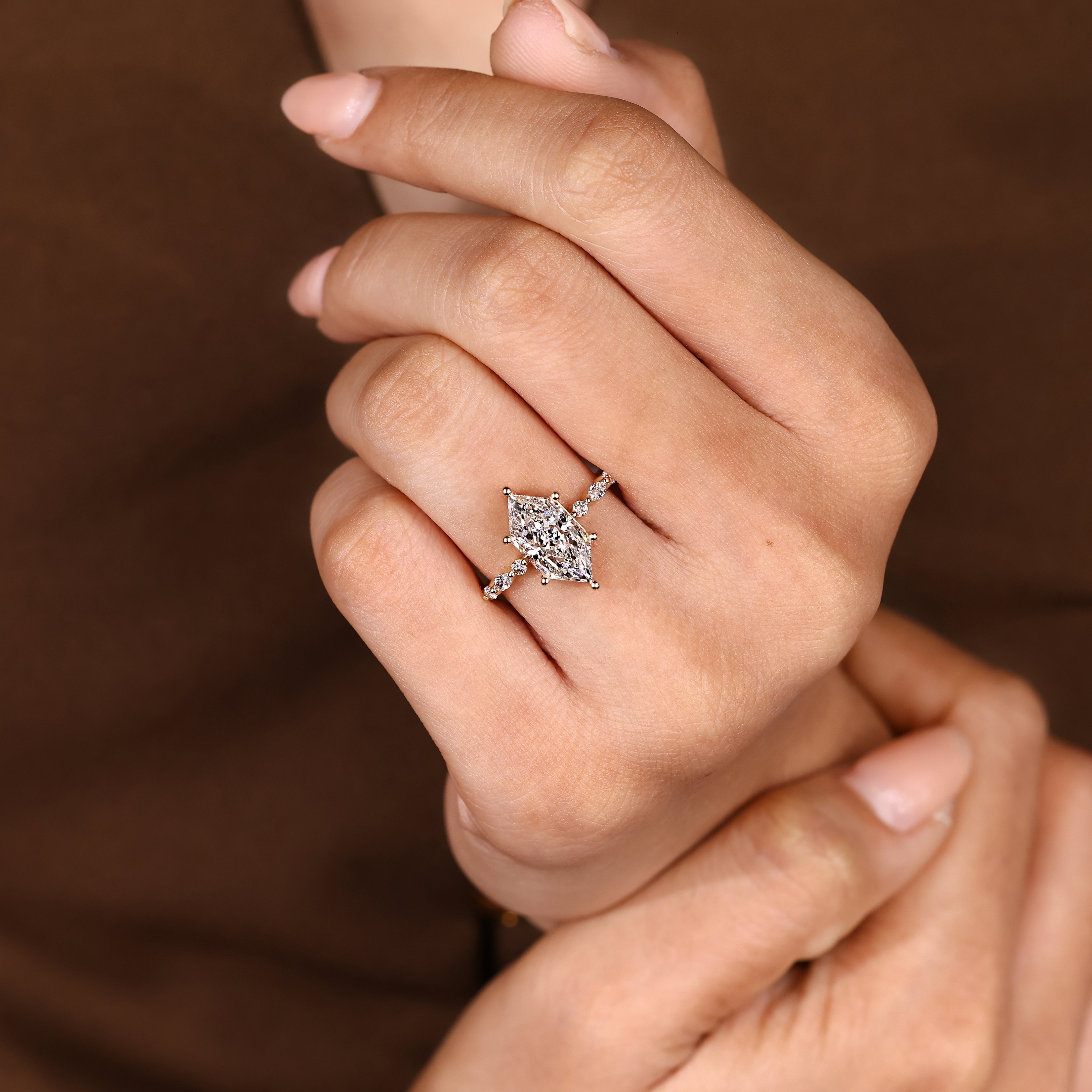 Lab grown marquise ring with distance pave prong details
