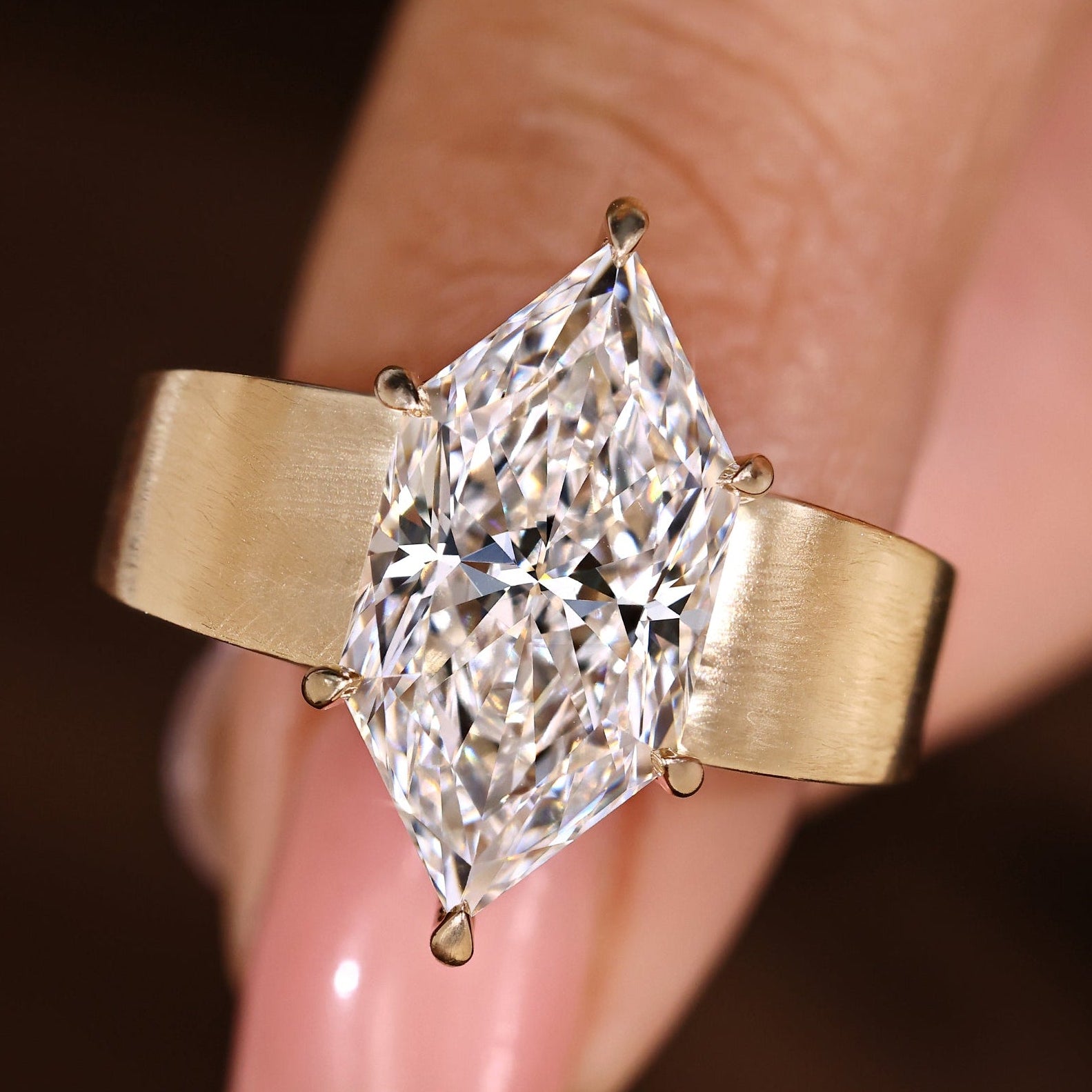 Dutch marquise diamond ring with six claw prong setting.
