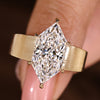 Dutch marquise diamond ring with six claw prong setting.
