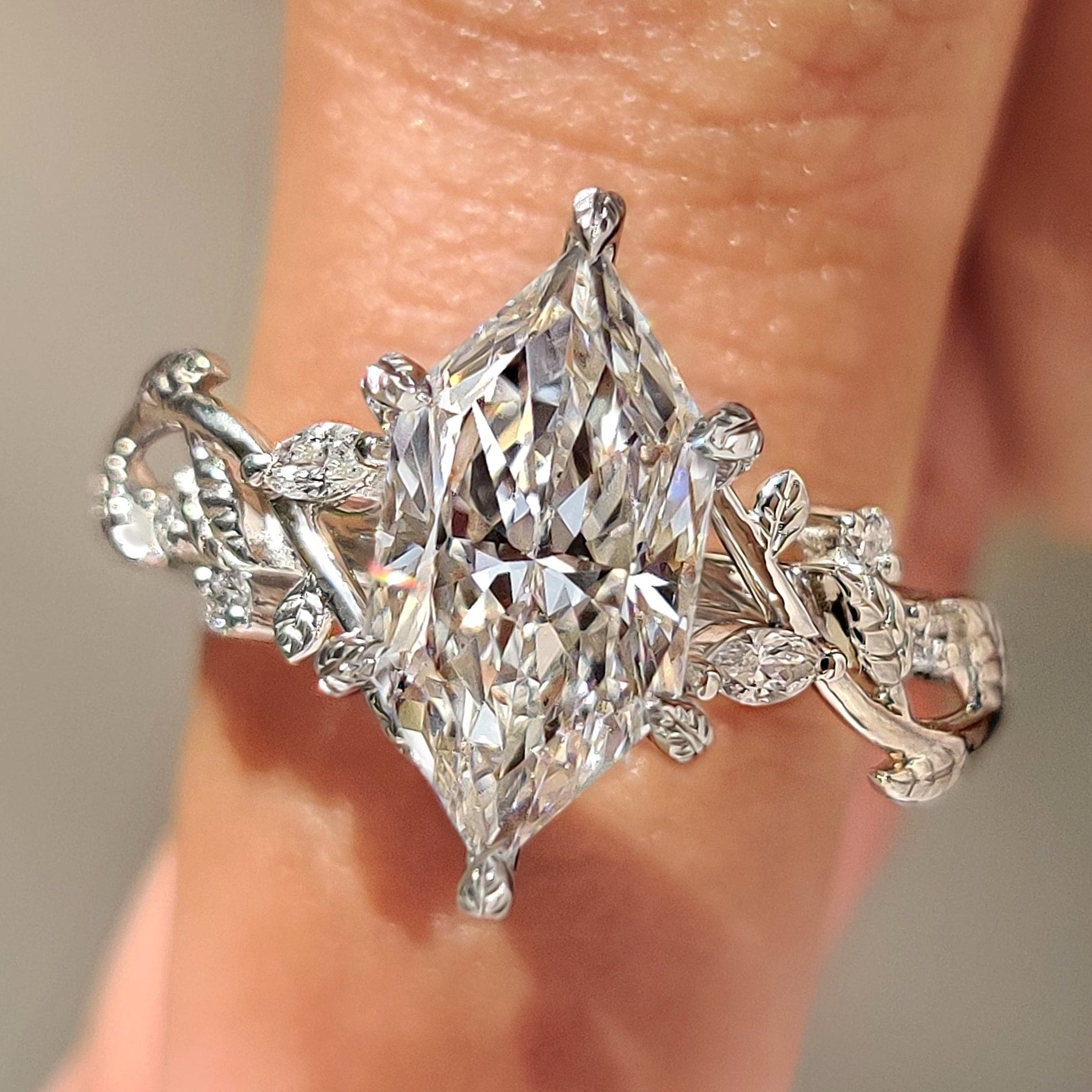Dutch marquise lab grown diamond ring with side stones.
