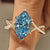 Dutch marquise engagement ring with blue aquamarine diamond center
