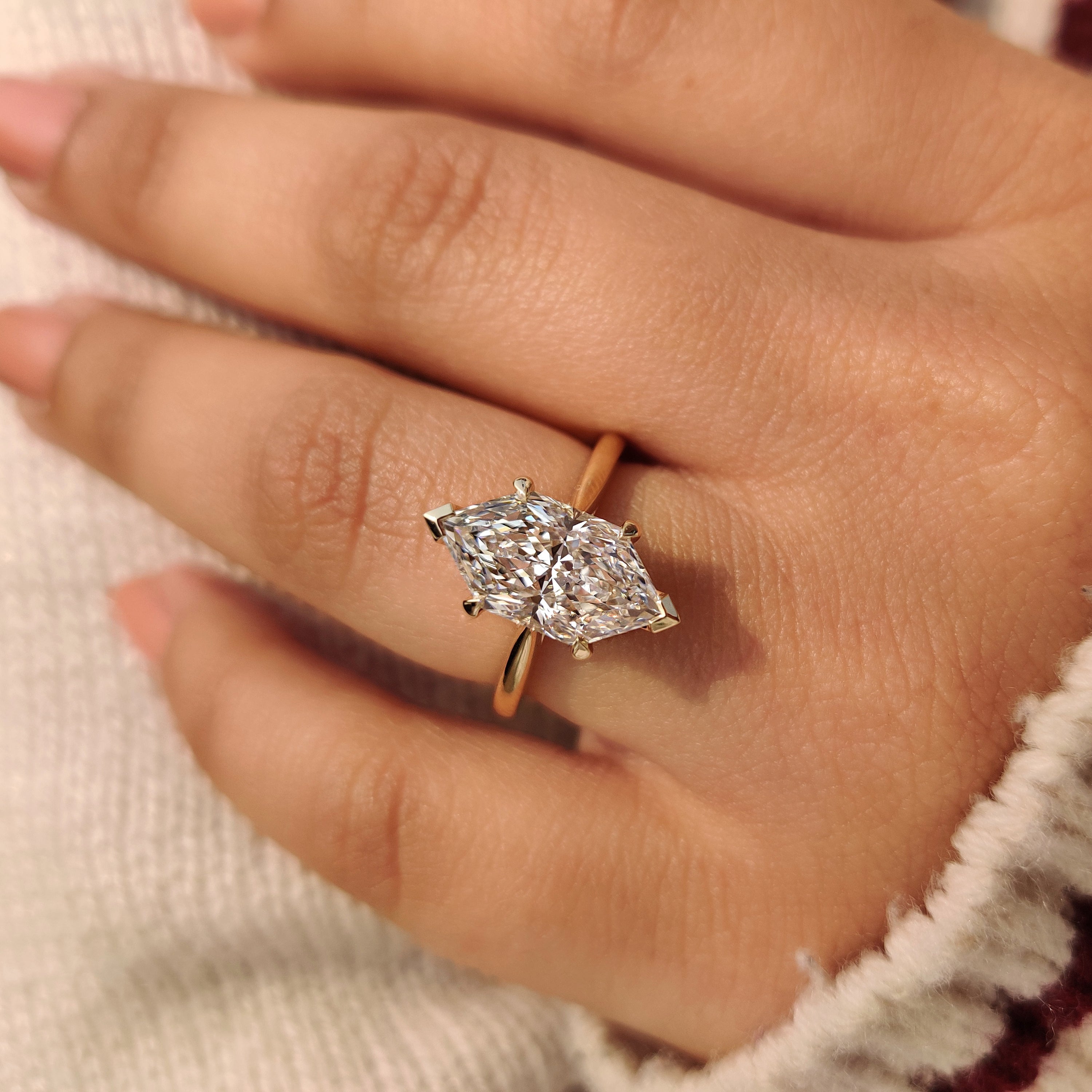 Handmade dutch marquise diamond ring with four claw prongs.
