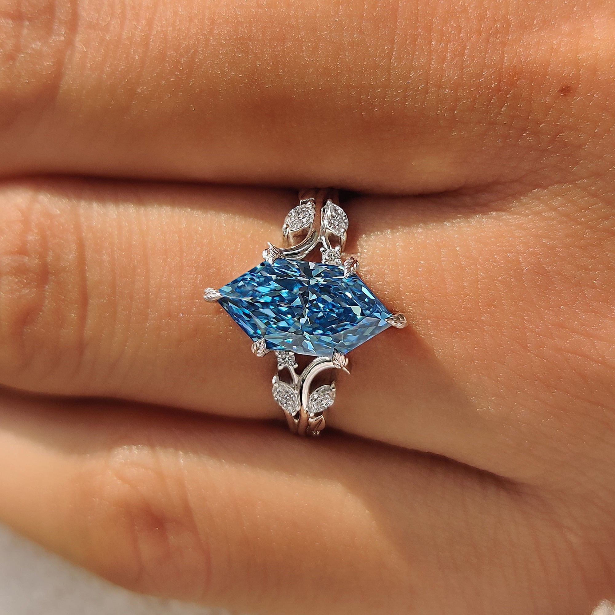 Handmade white gold ring with a blue Dutch marquise diamond.
