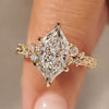Dutch marquise diamond ring with round side stones.
