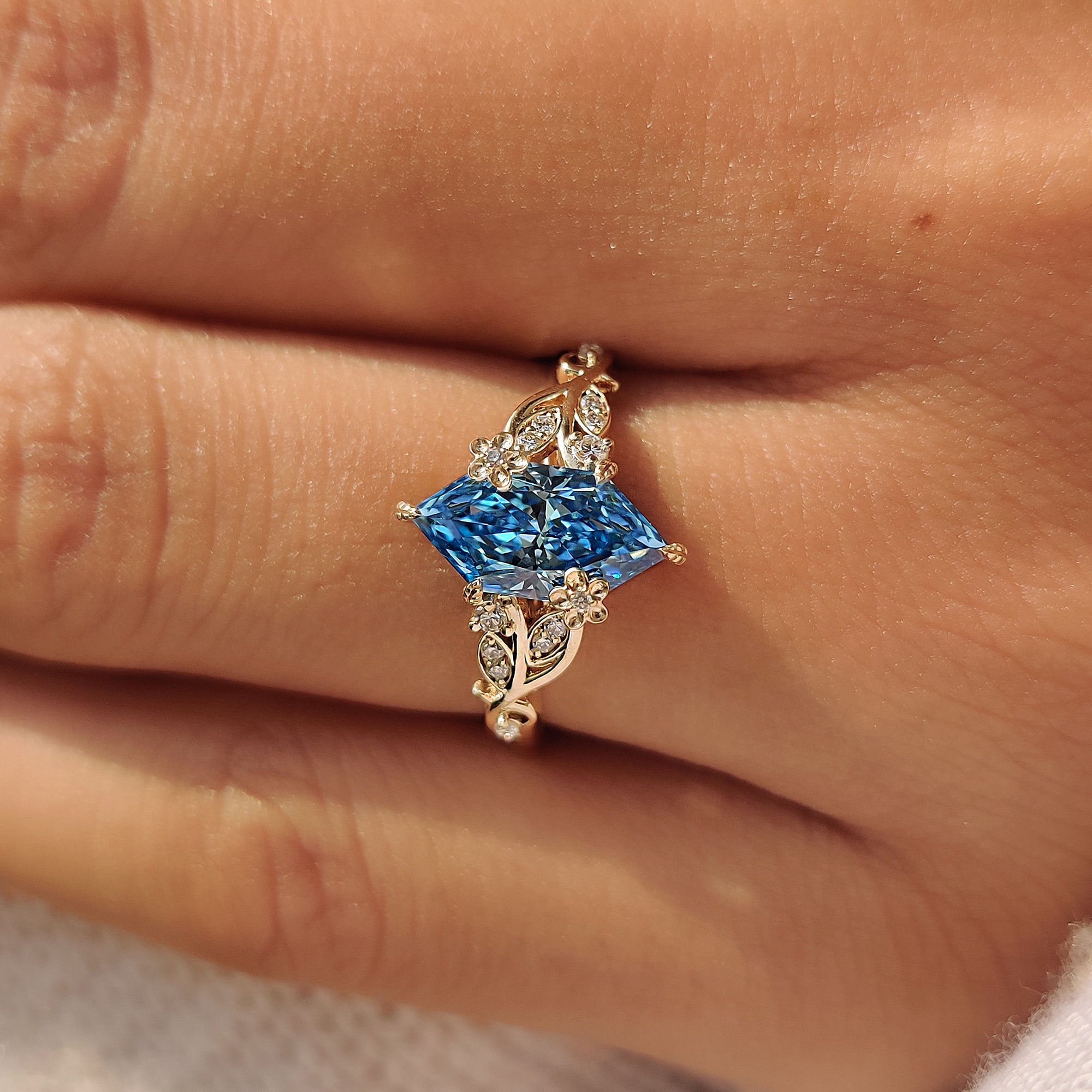 Nature inspired engagement ring with leaf, vine and floral details.
