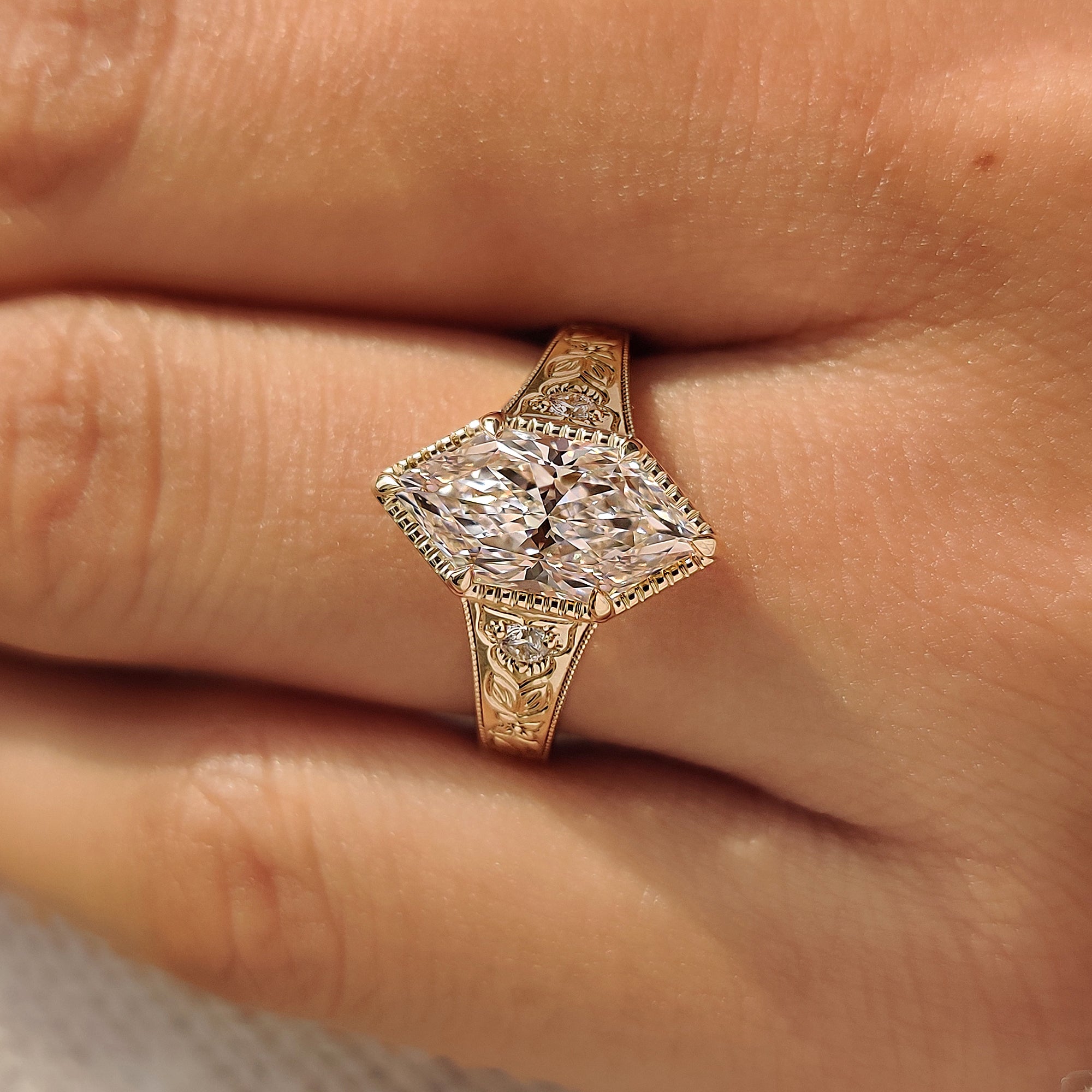Nature inspired Dutch marquise three stone engagement ring.
