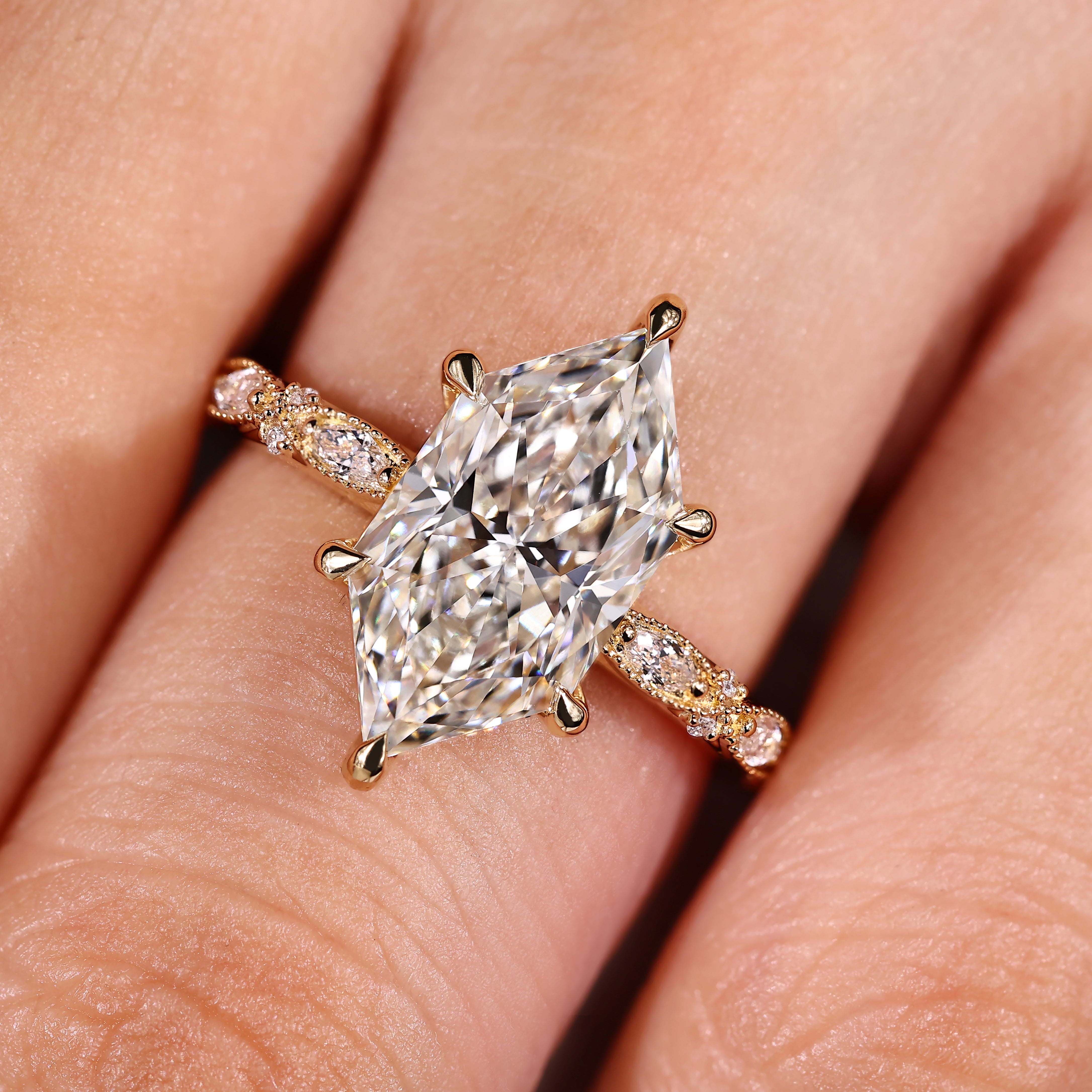 Hidden halo setting beneath dutch marquise center diamond
