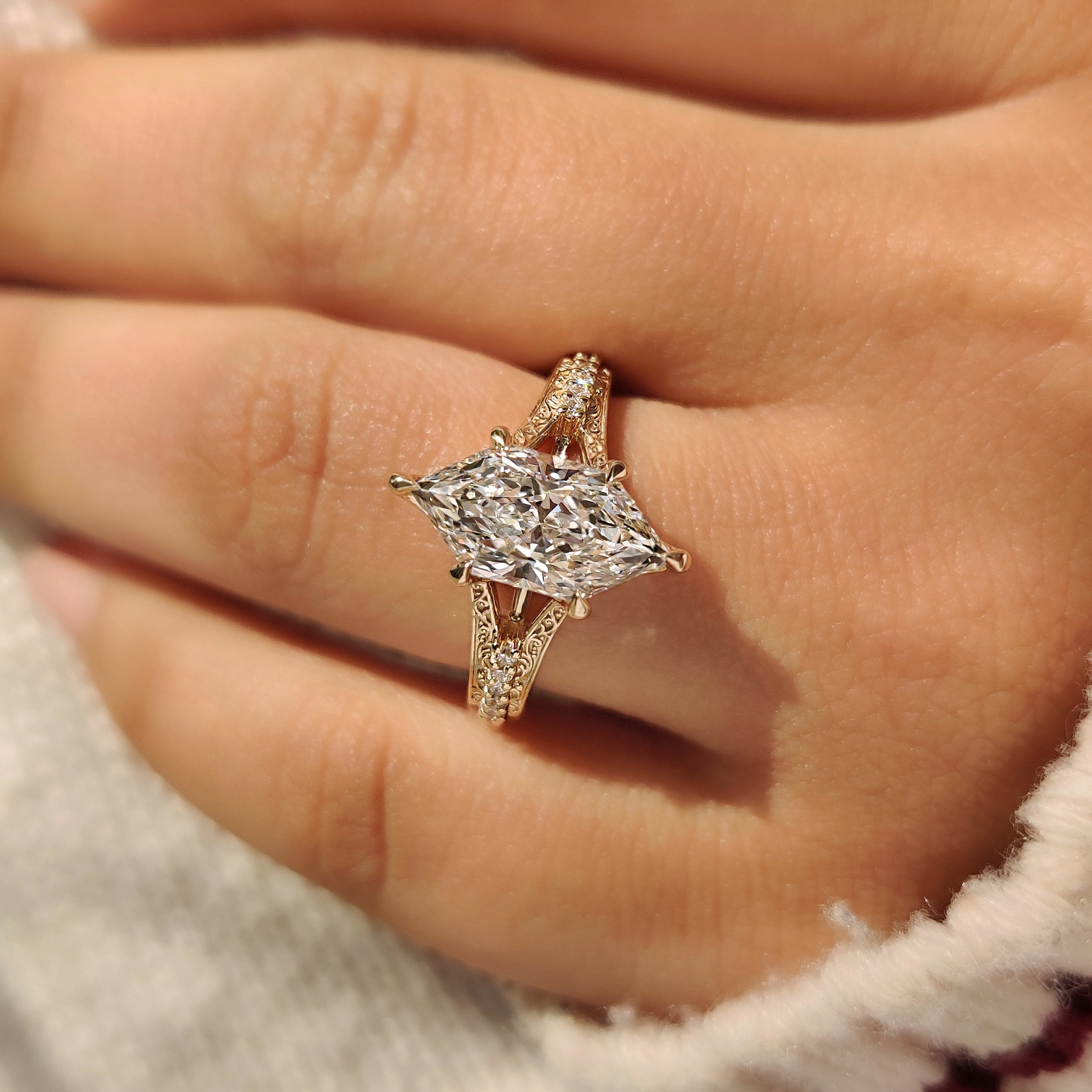 Vintage style marquise diamond ring with cathedral setting design
